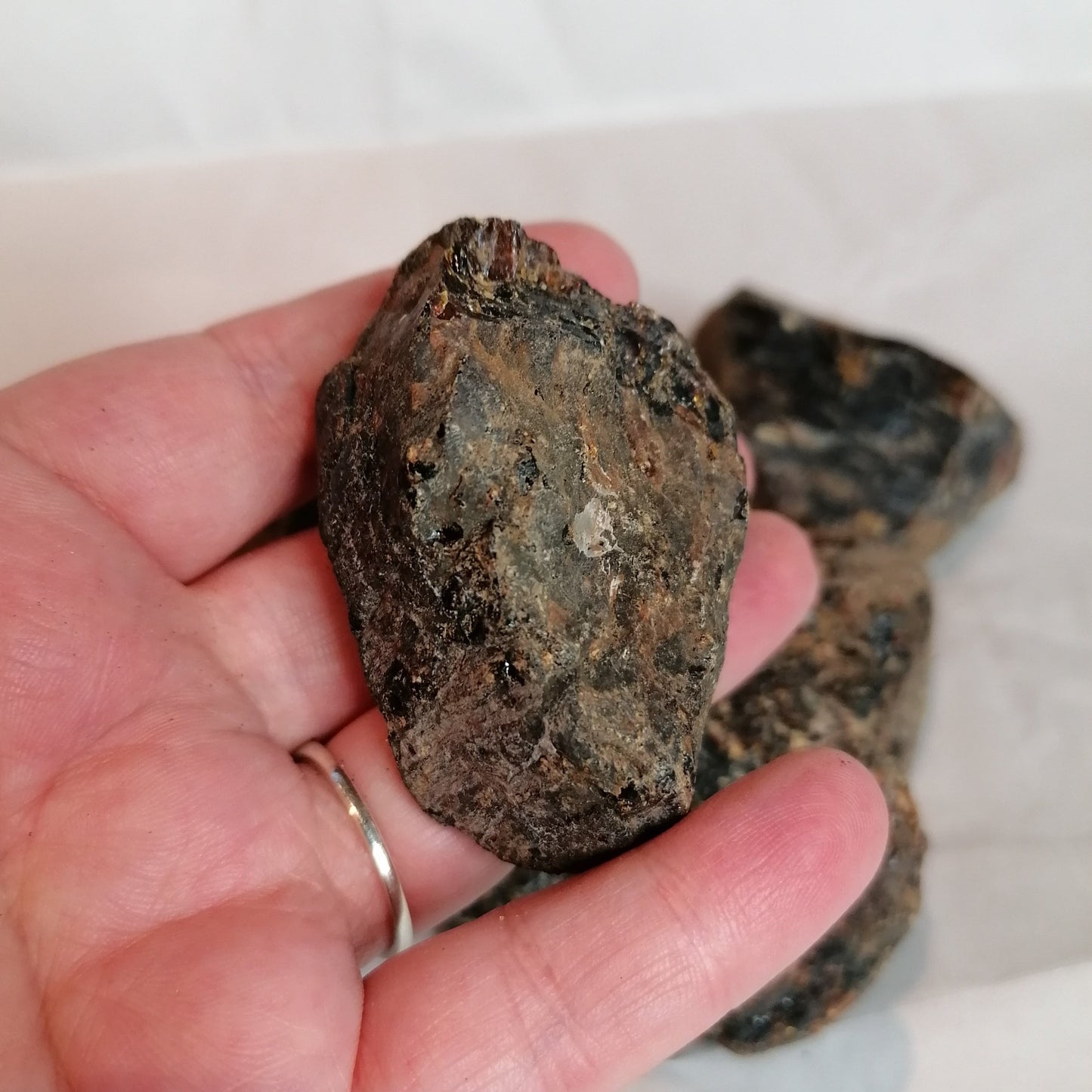 close up of the non-shiney side of the black amber crystal