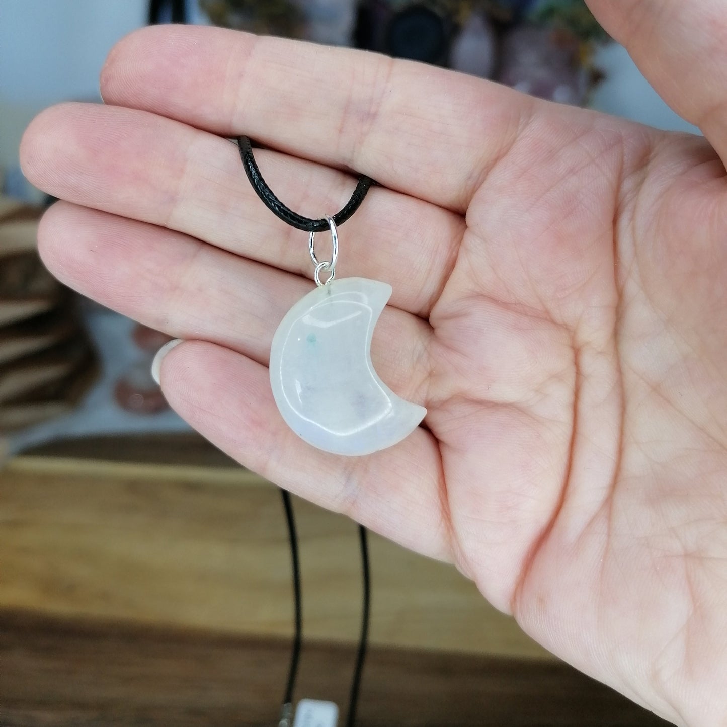 Rainbow Moonstone Moon Necklace with Blue Flash on a black chord chain
