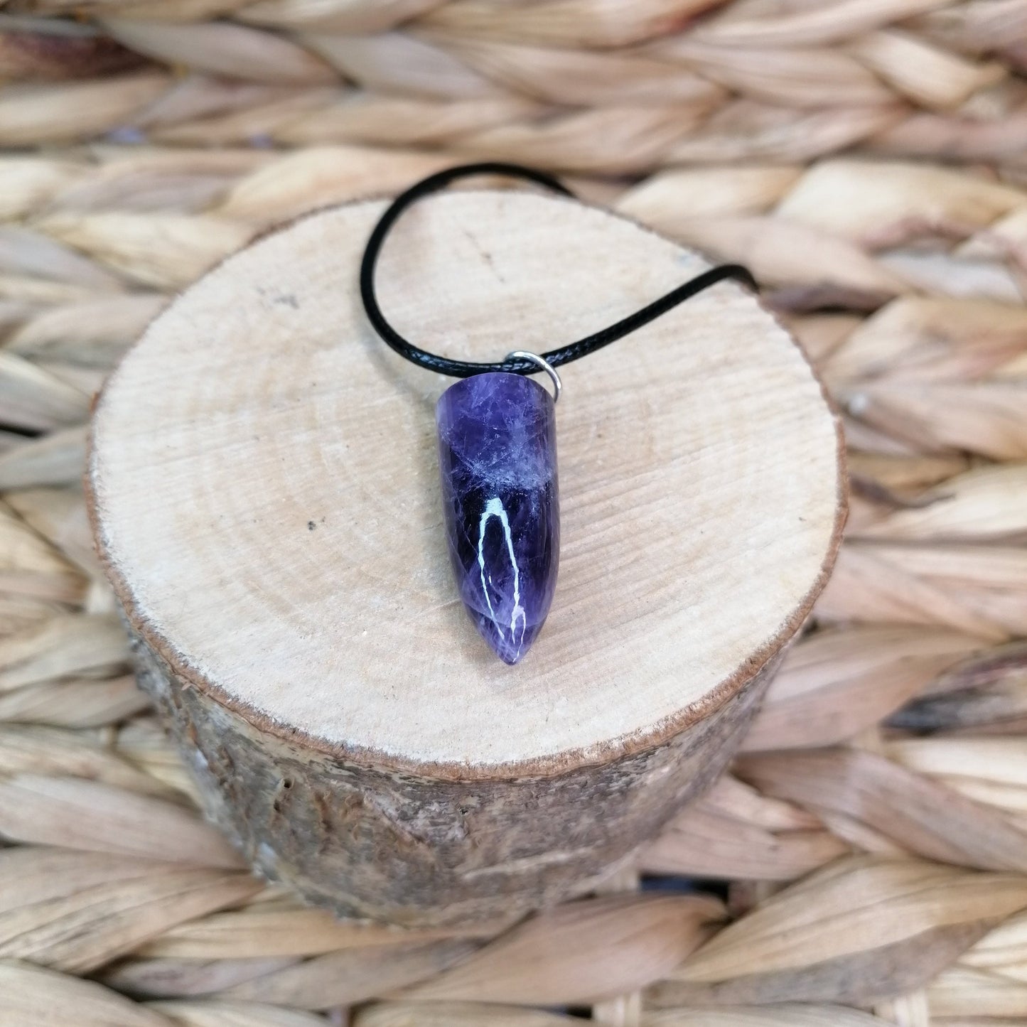 Purple Amethyst Bullet shaped crystal pendant necklace on a black chord chain