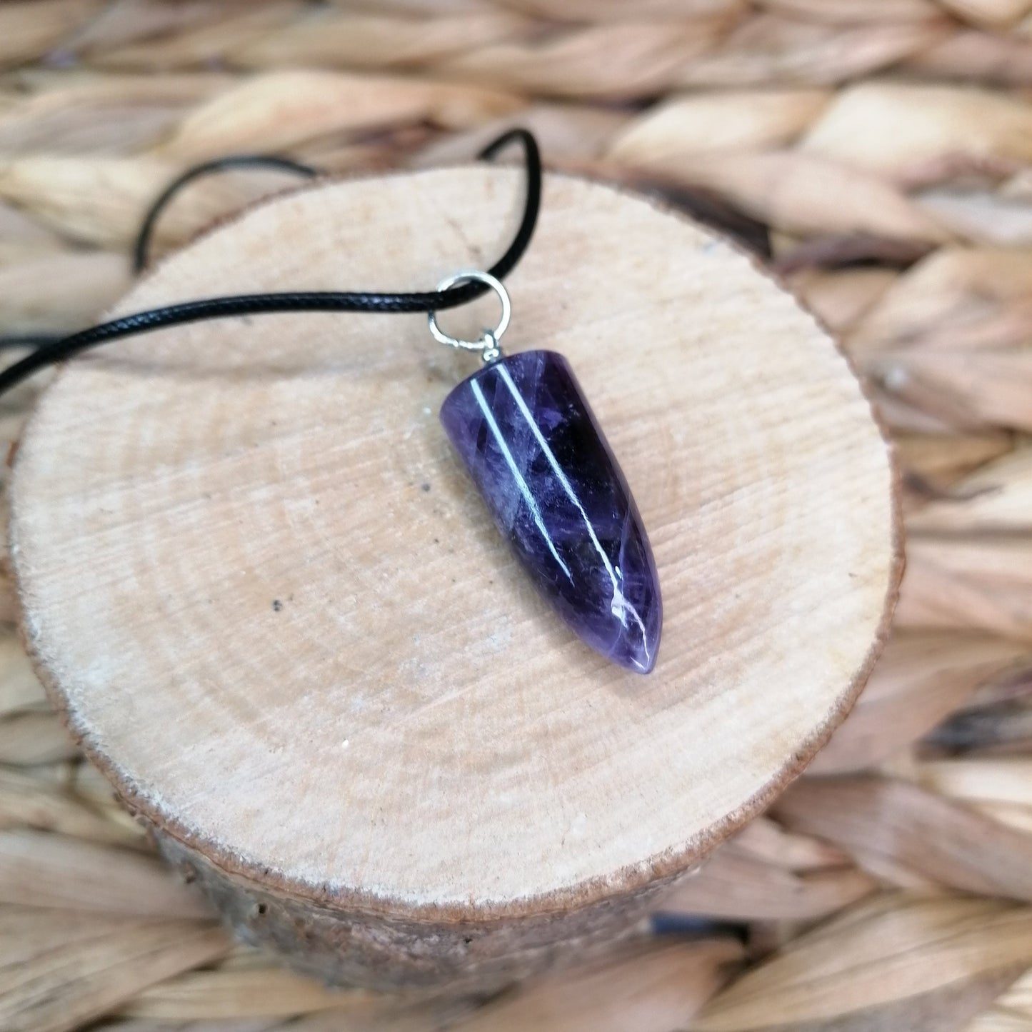 Purple Amethyst Necklace with a bullet shaped pendant and black chord chain