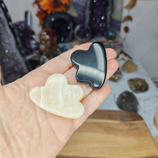 Black obsidian and yellow calcite crystal shaped clouds