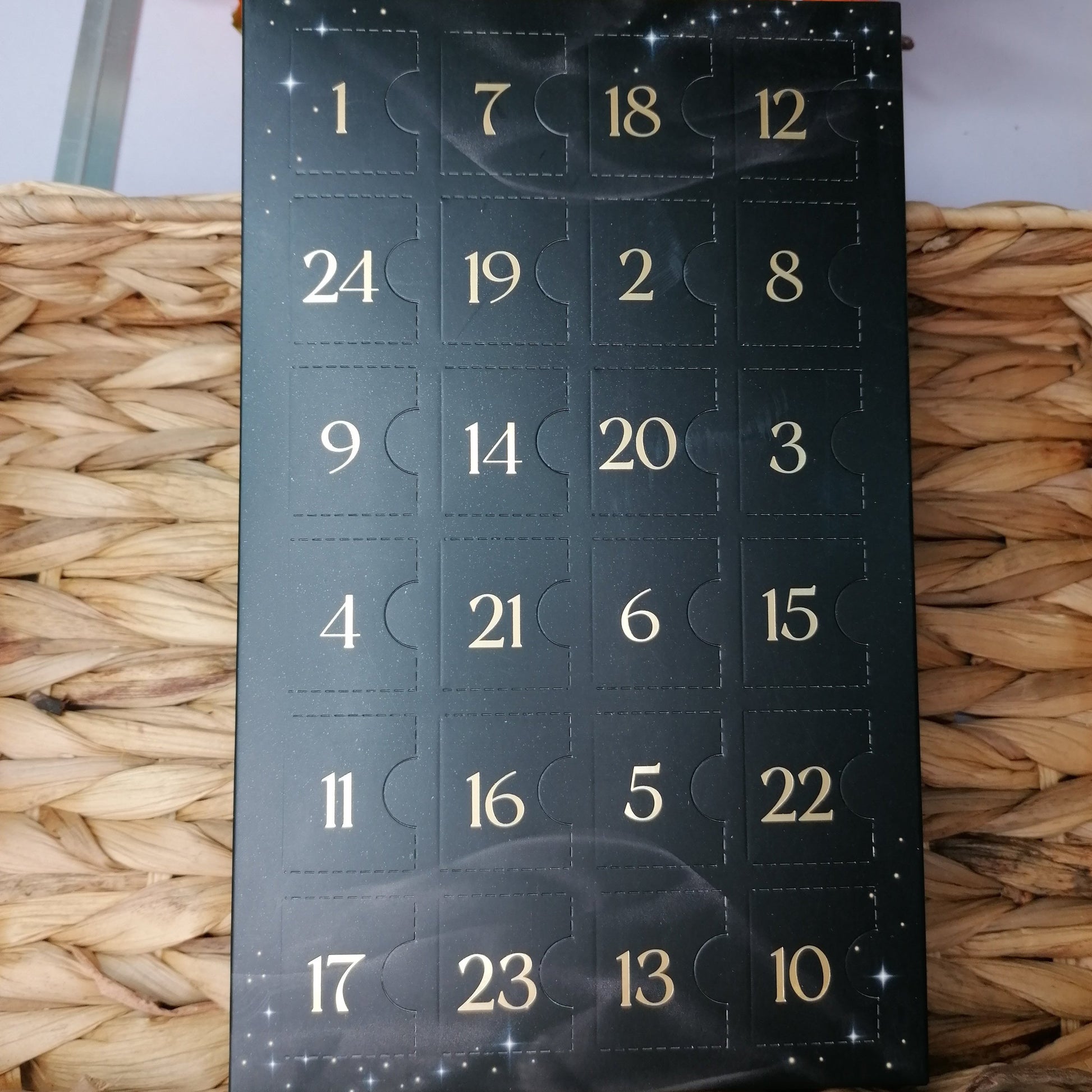 Crystal Advent Calendar containing 24 tumblestones. This black mindful advent calendar is the perfect way to countdown to the holiday season