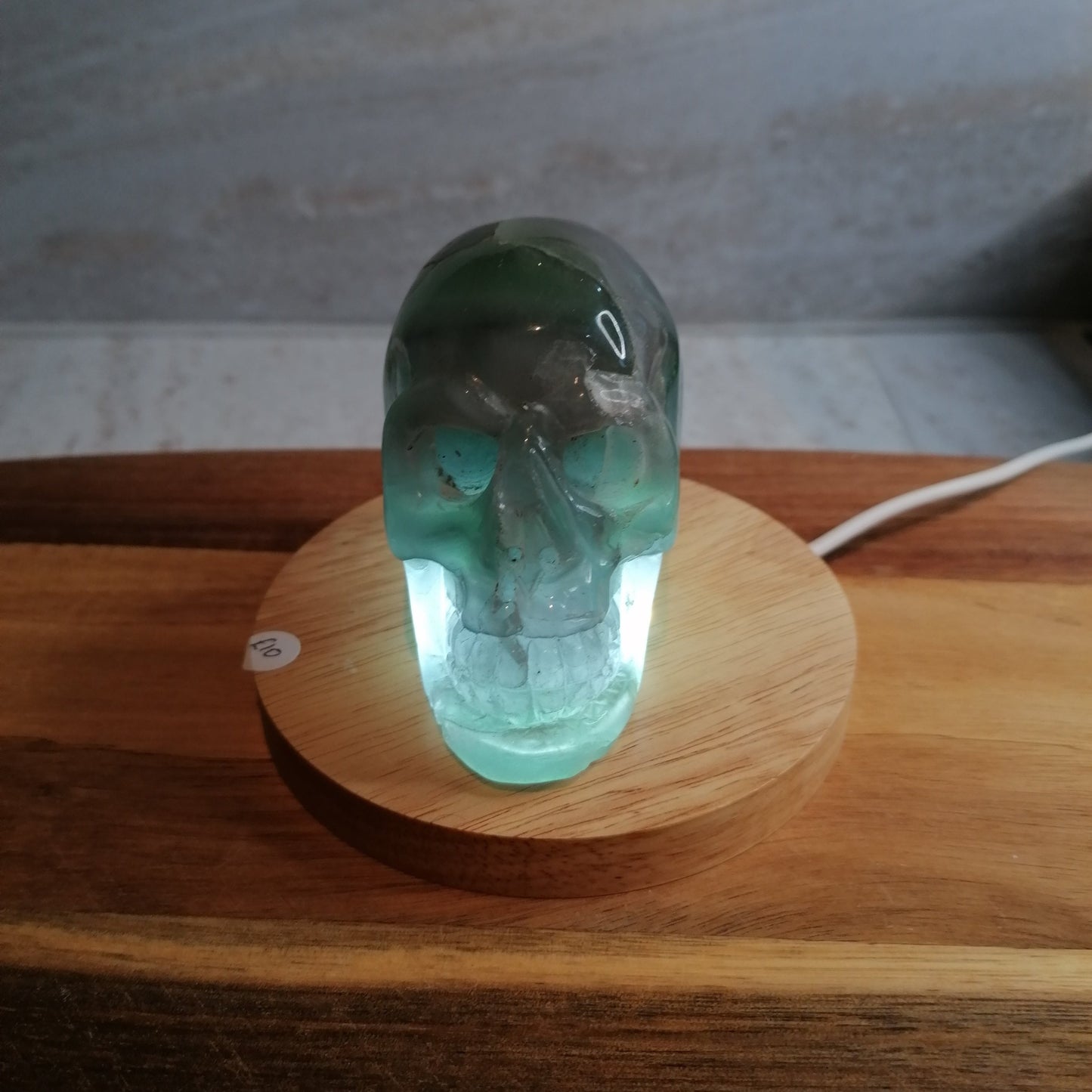 Dark Green Fluorite Skull on light pad