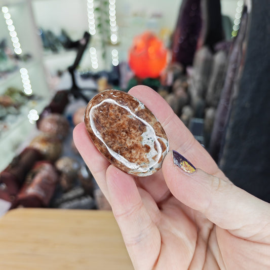 Garnet in Limestone Palm Stone