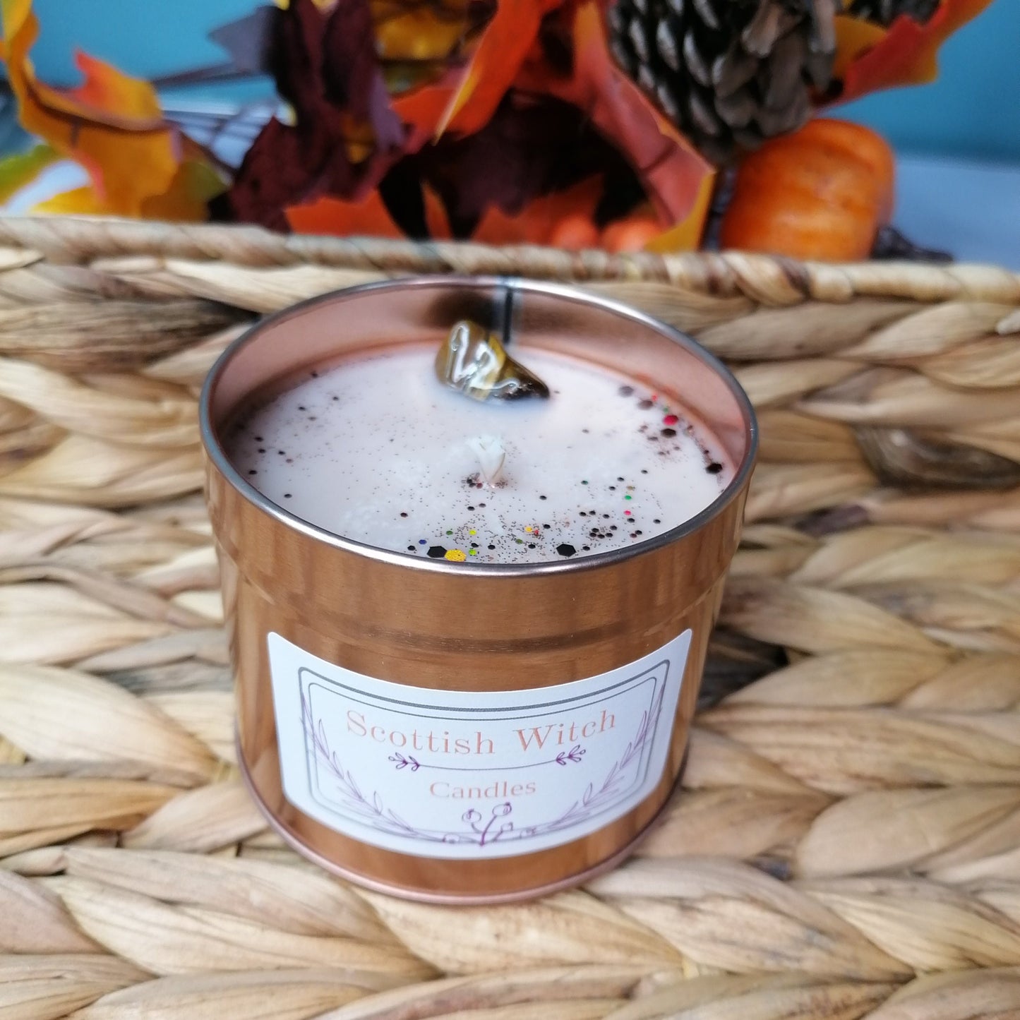 A Gingerbread scented candle with Tigers Eye crystal and glitter