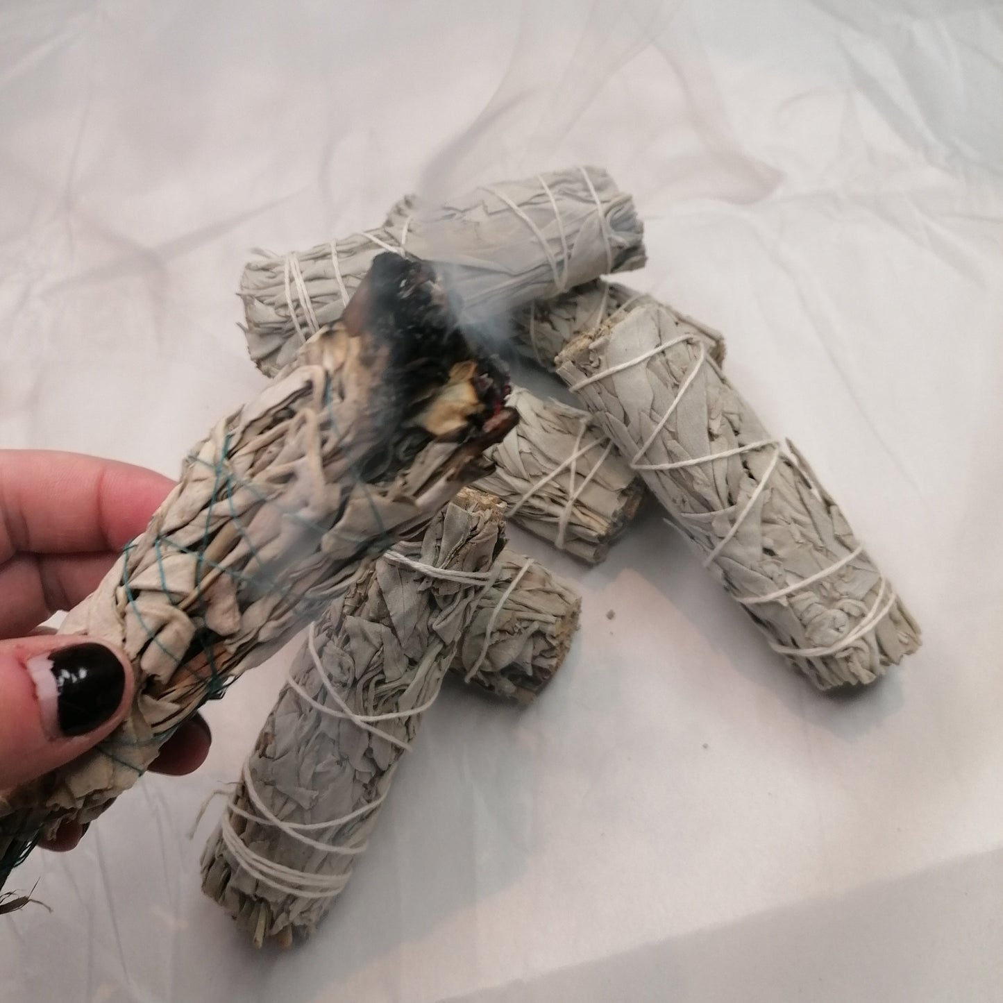 A burning white sage smudge stick