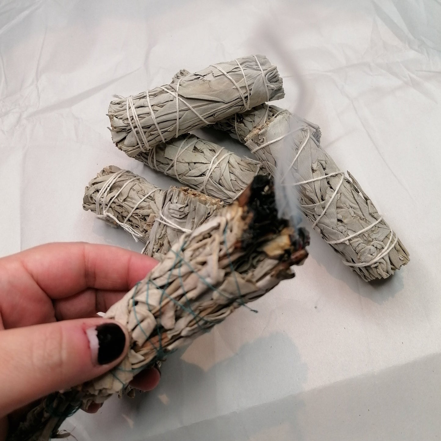 a burning white sage smudge stick