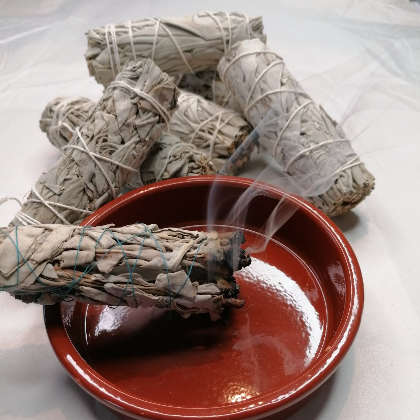 a burning white sage smudge stick