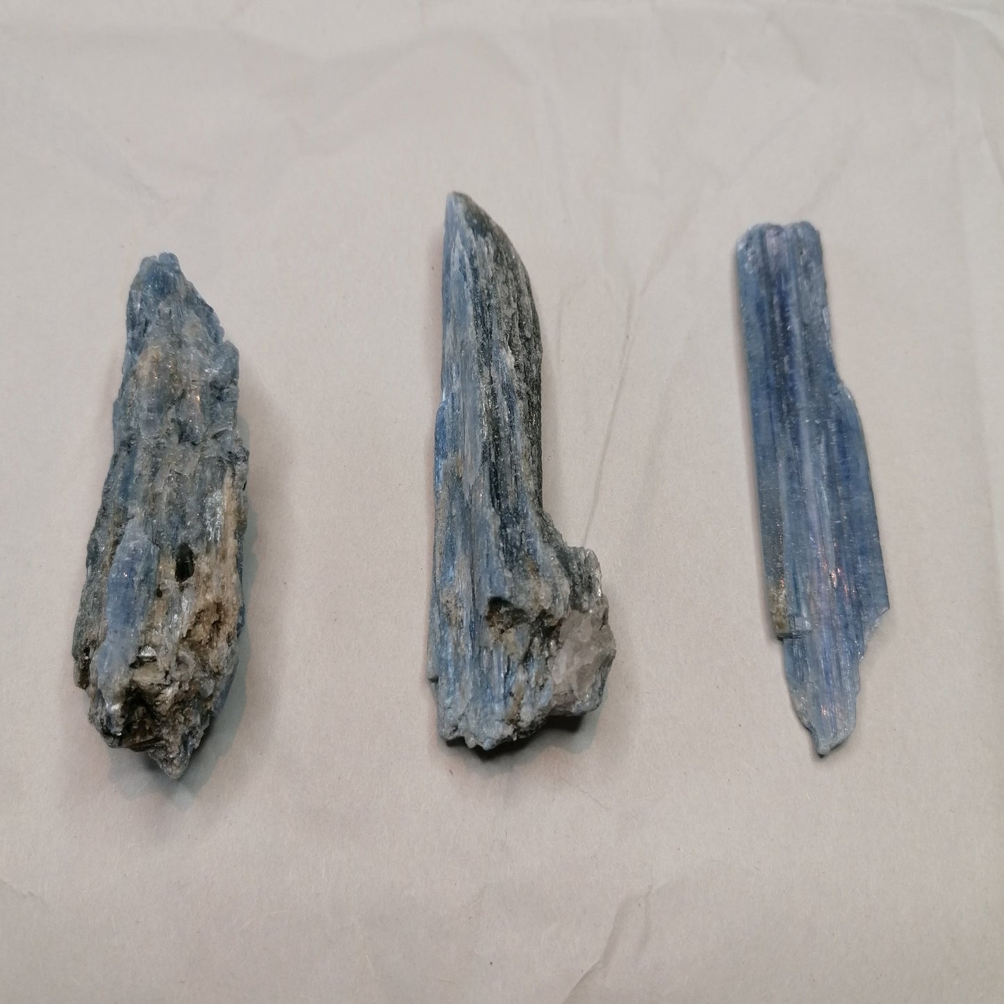 three pieces of blue kyanite blades