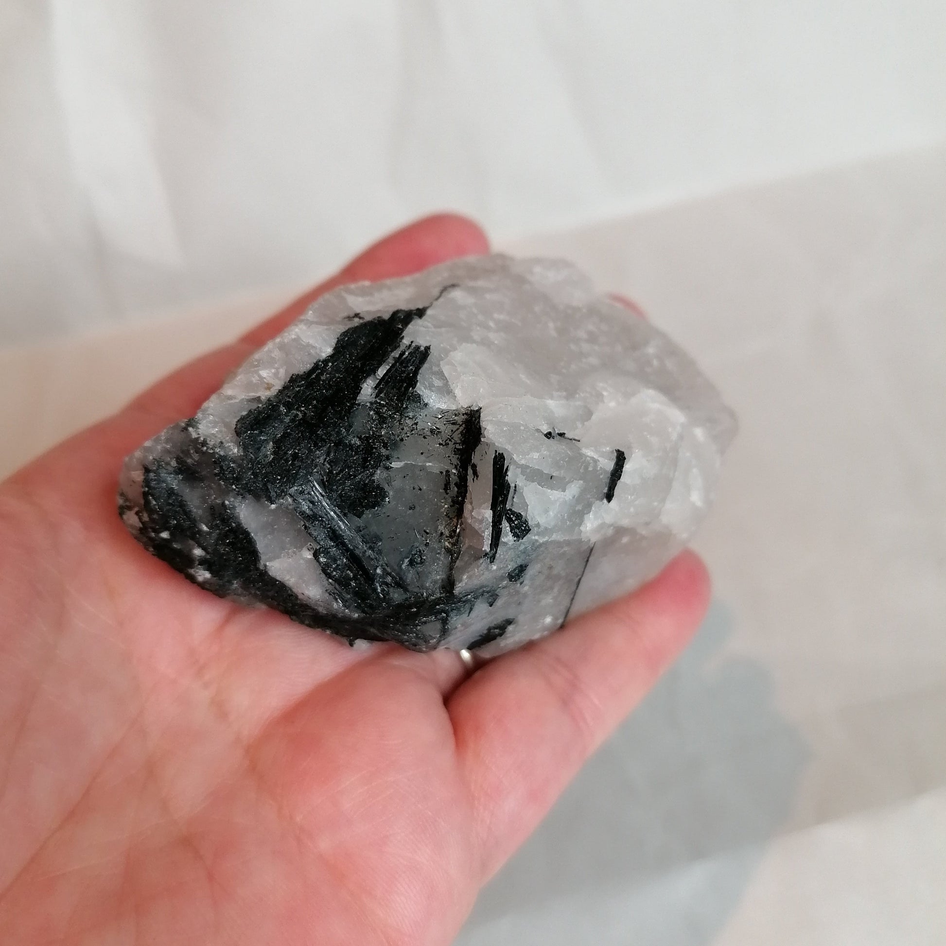 raw white quartz with black tourmaline running through