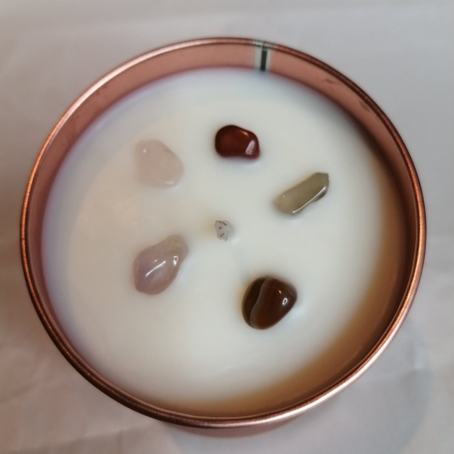 white wax candle in a rose gold tin decorated with mixed colour crystal chips