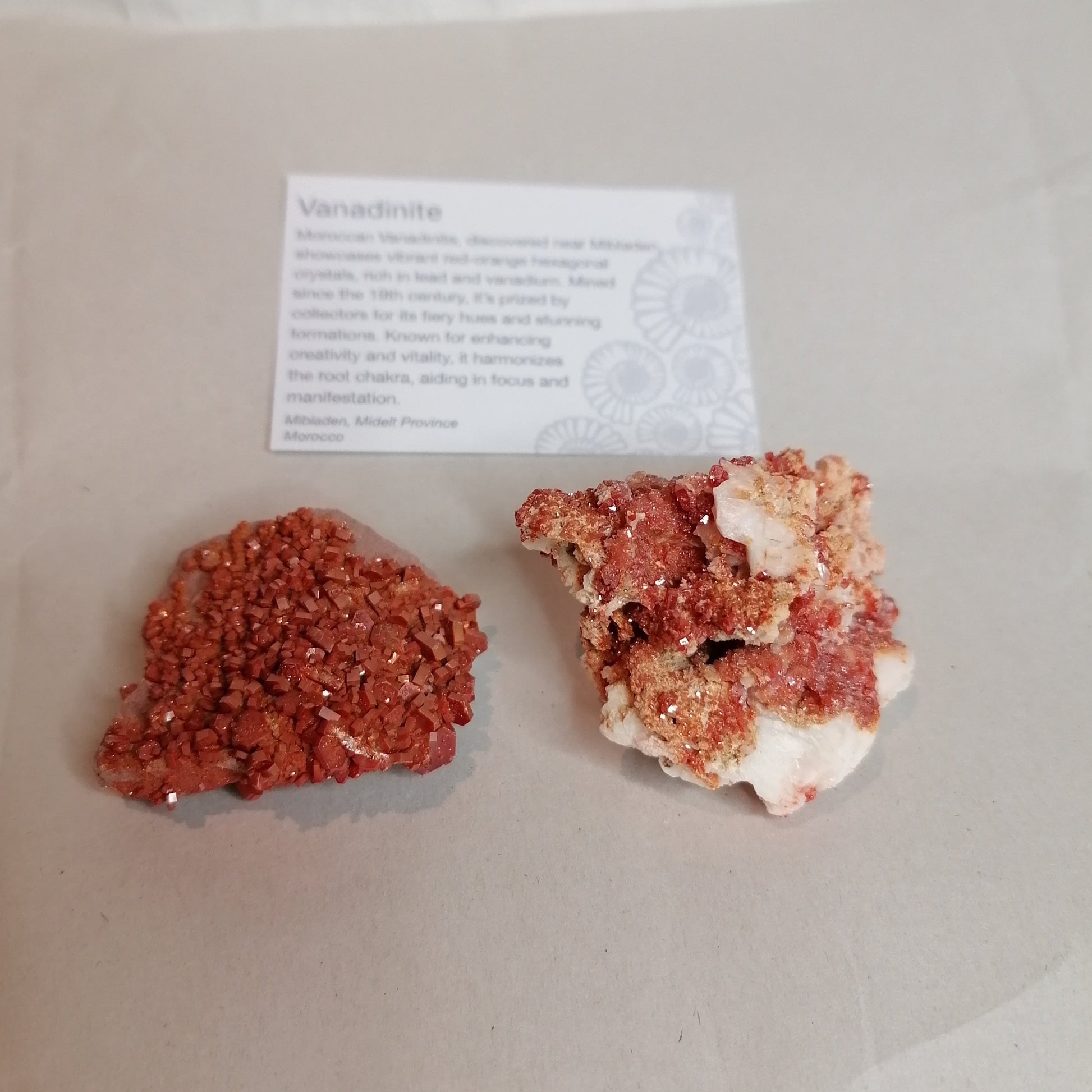 bright orange square crystals on a cream rock formation, vanadinite crystal specimen