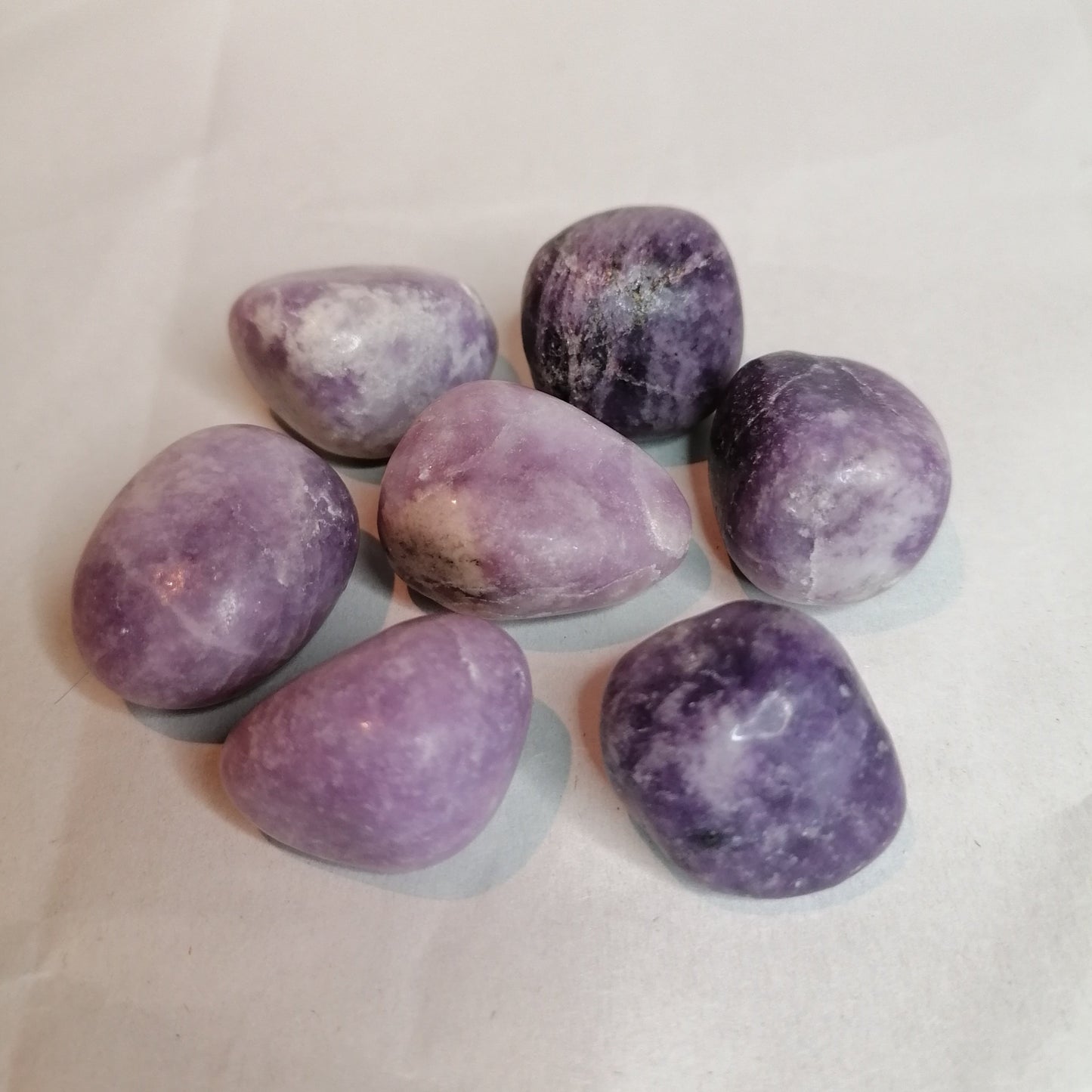 all shades of purple and white lepidolite tumblestones