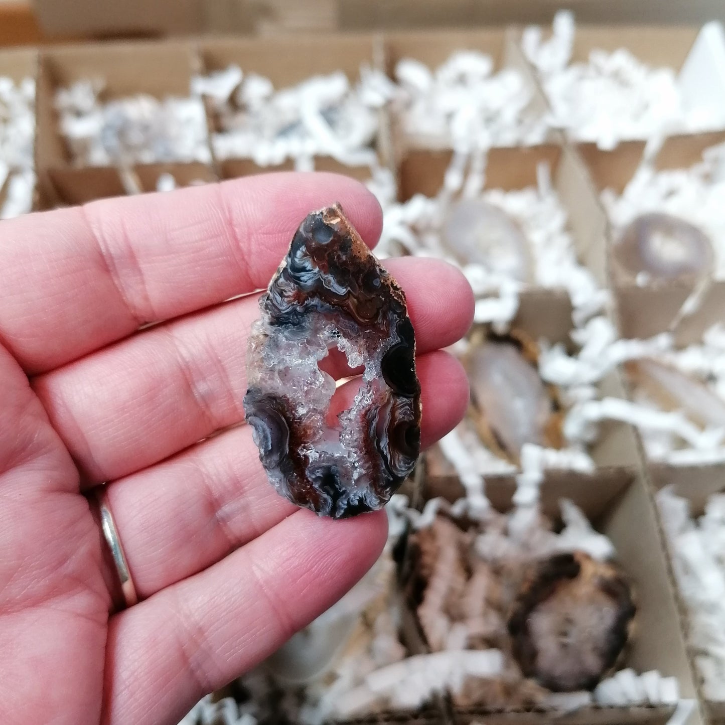 agate geode slice that is black with a white sparkly centre