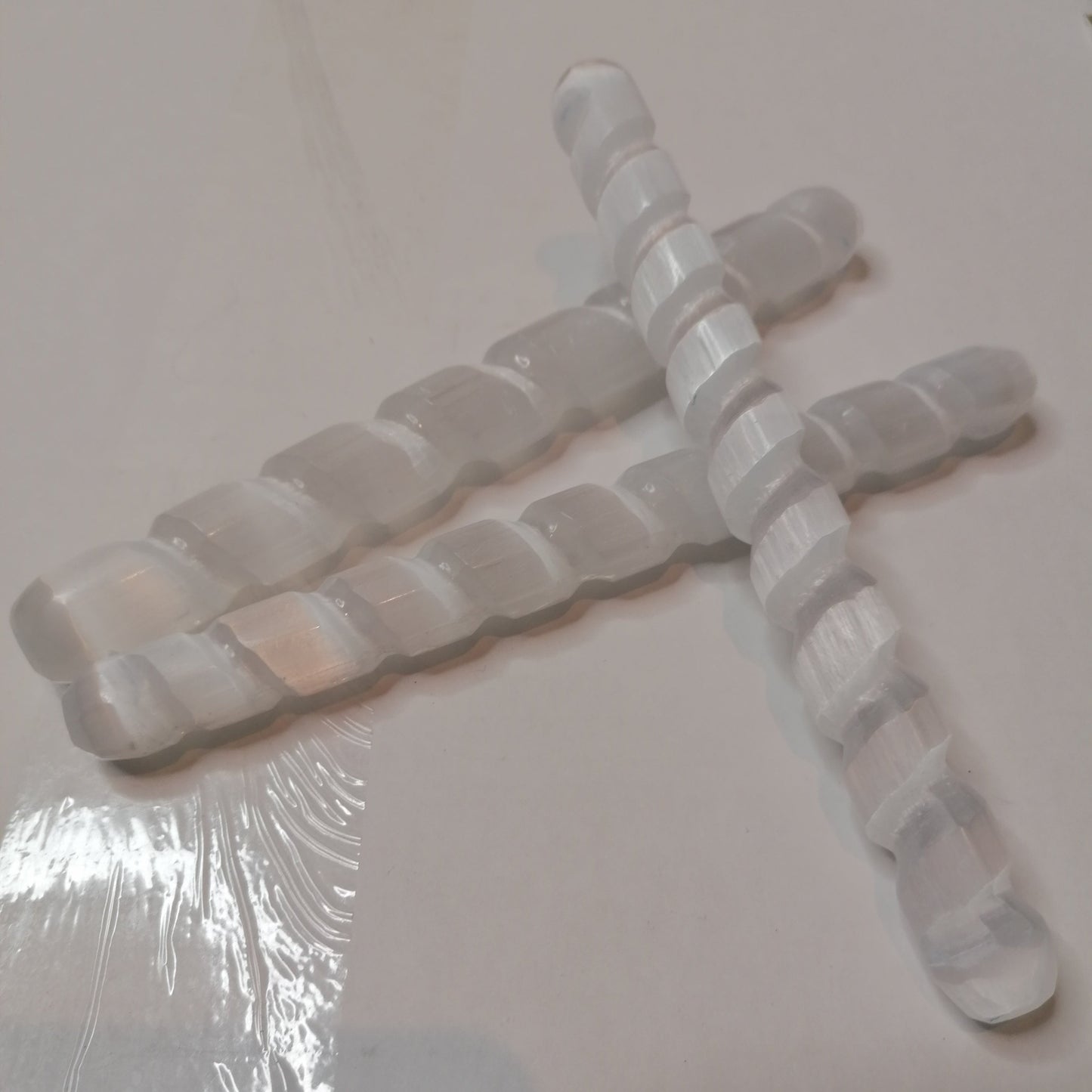 three spiral white selenite wands