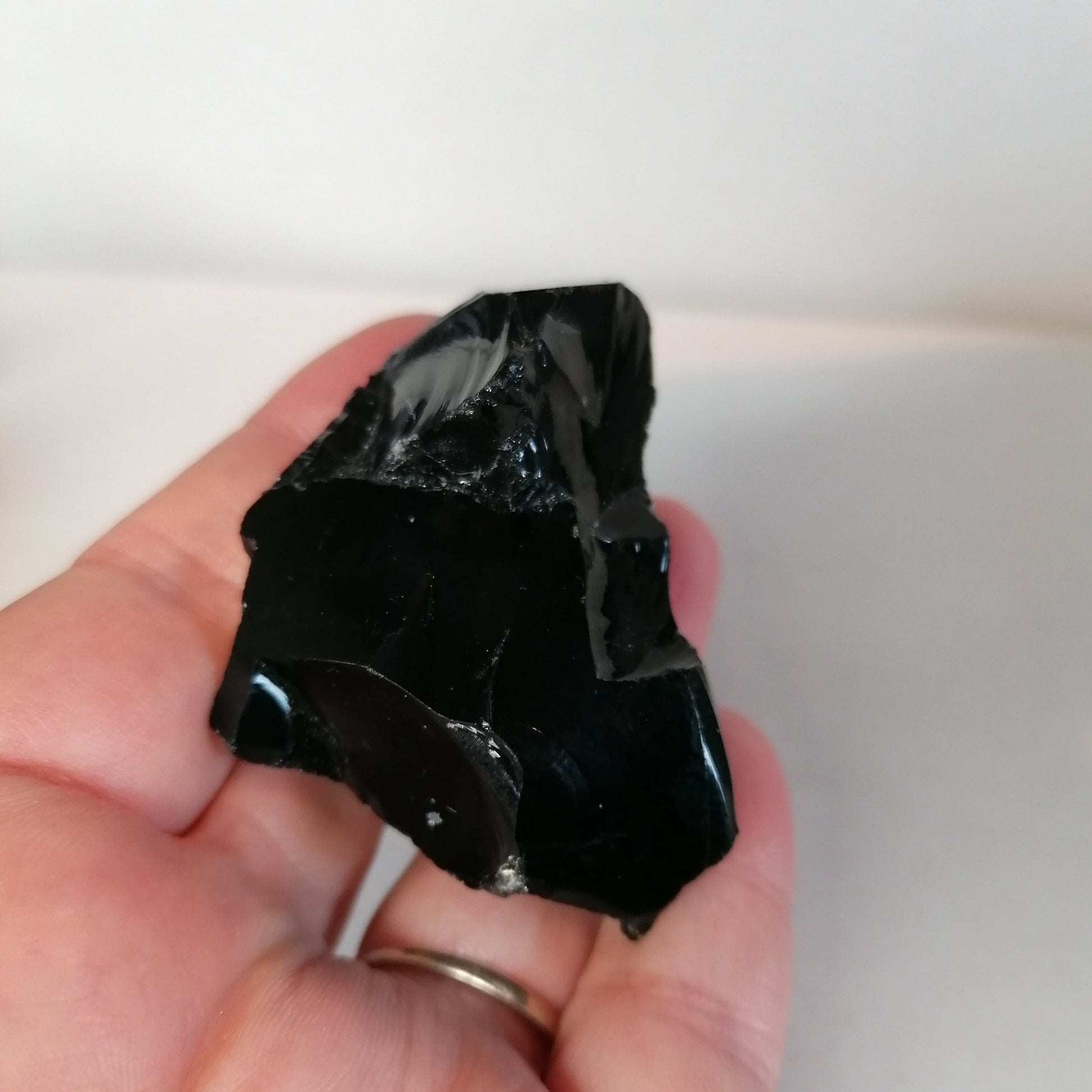 raw black obsidian chunk close up