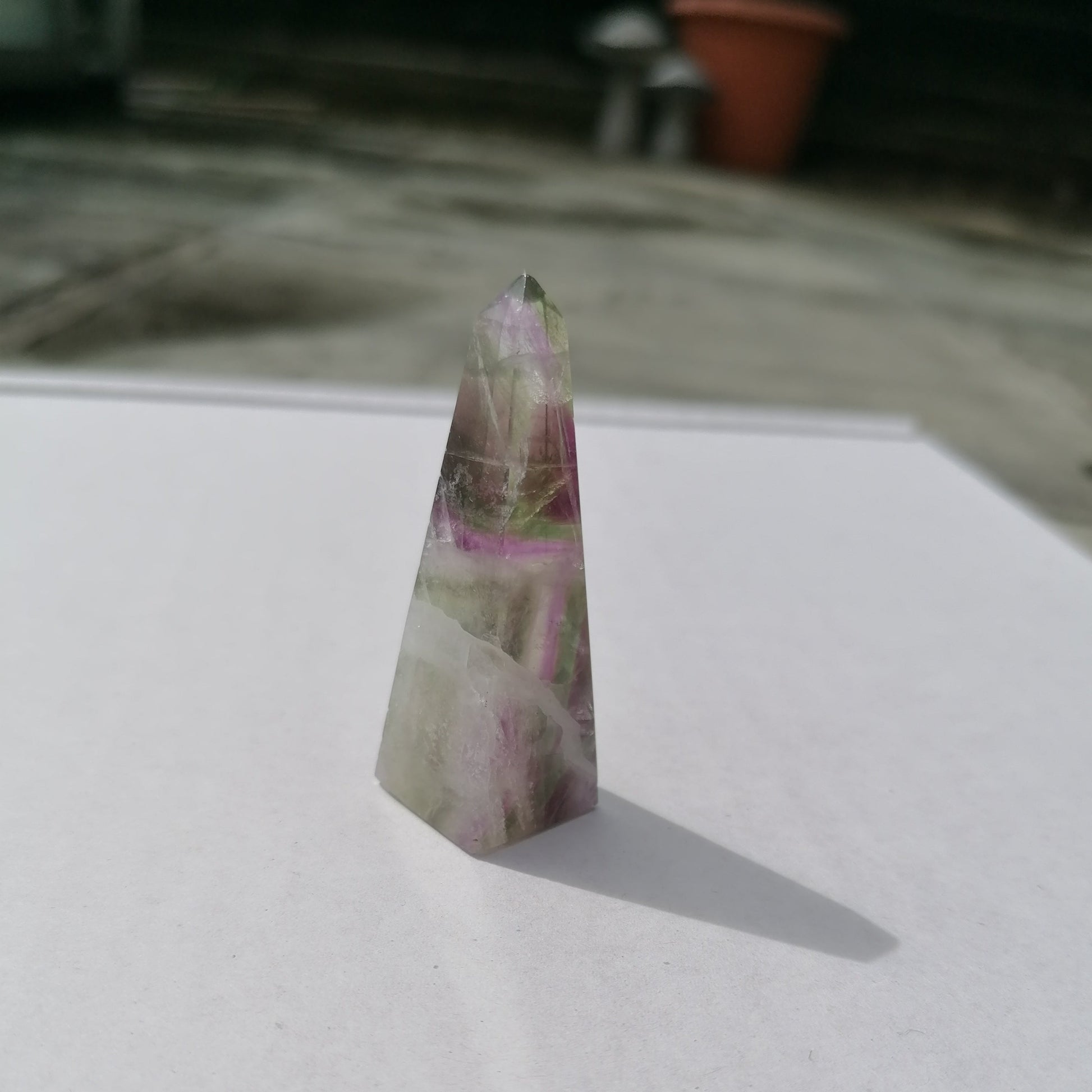 strong purple with green inclusions fluorite obelisk