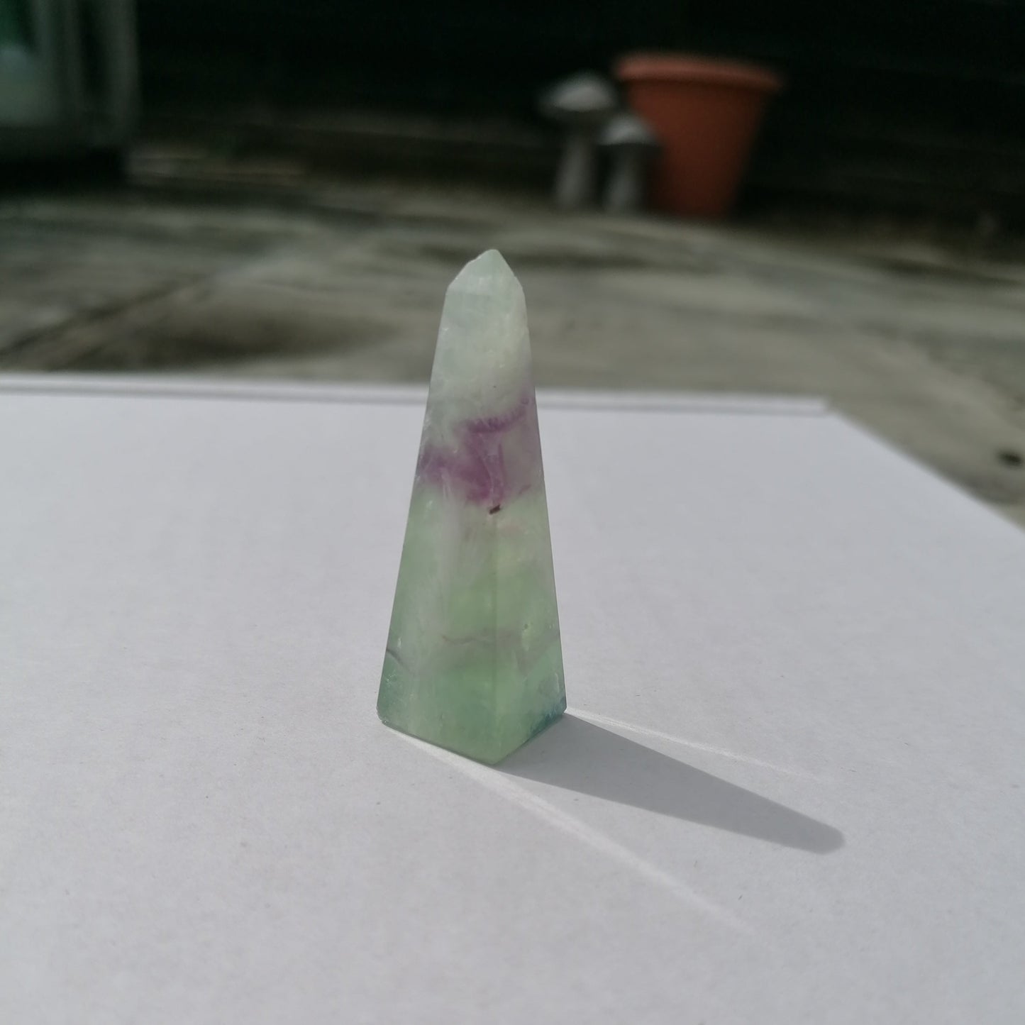 white and green fluorite with purple inclusion obelisk