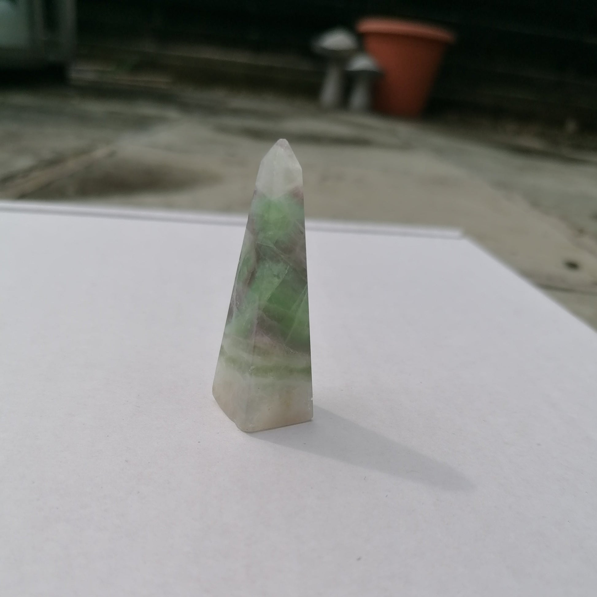 green white and purple fluorite obelisk tower