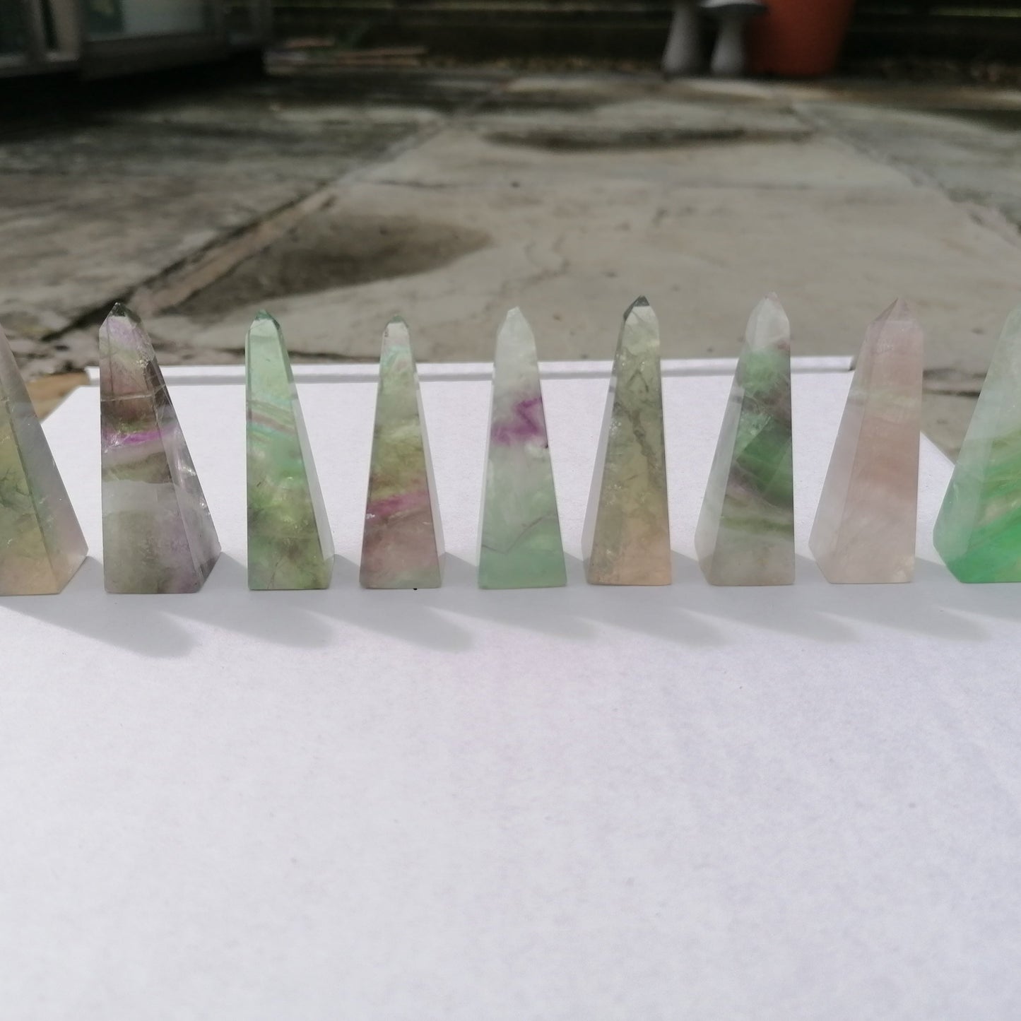 green and purple fluorite obelisks