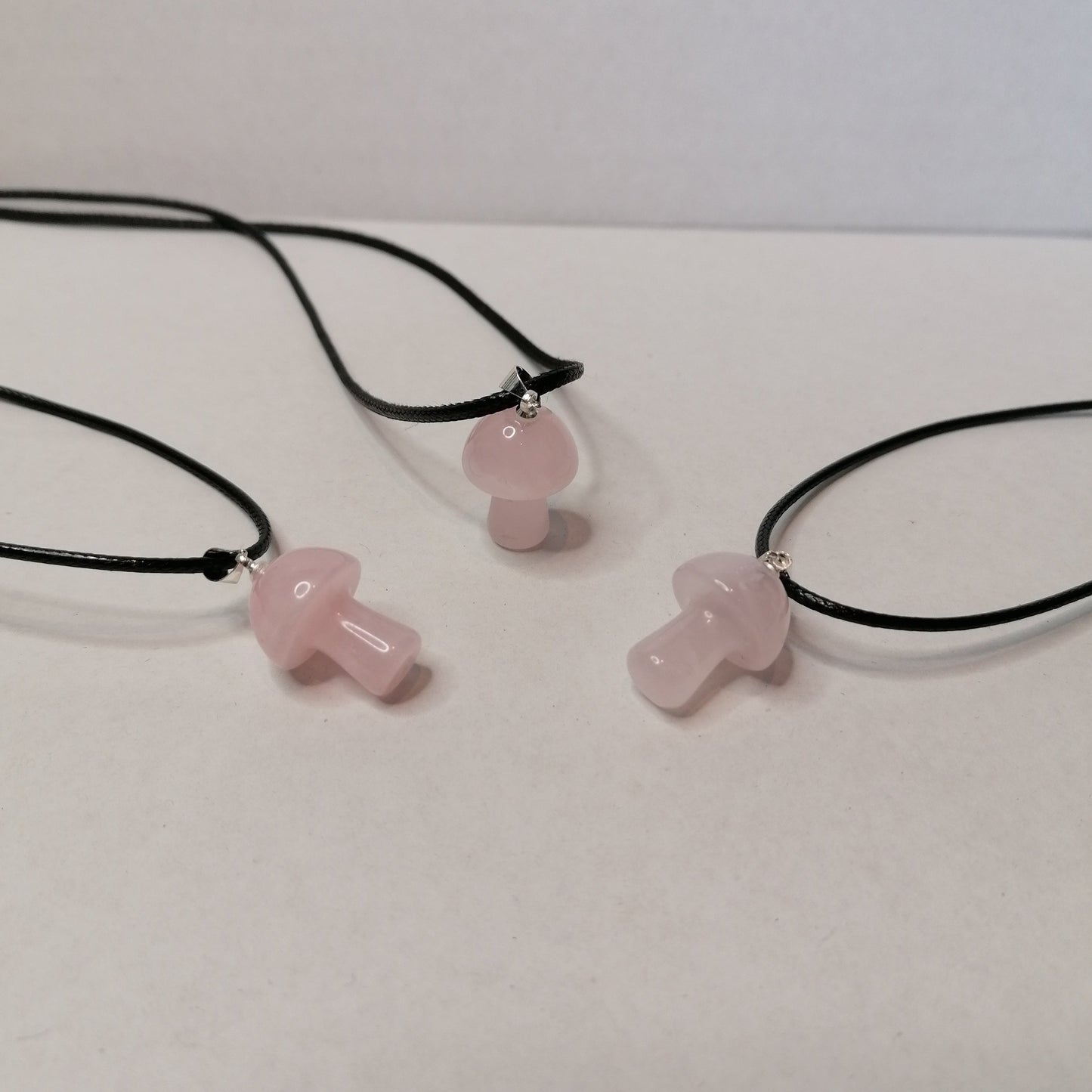 pink rose quartz mushroom pendants on black chorn neckalce chain