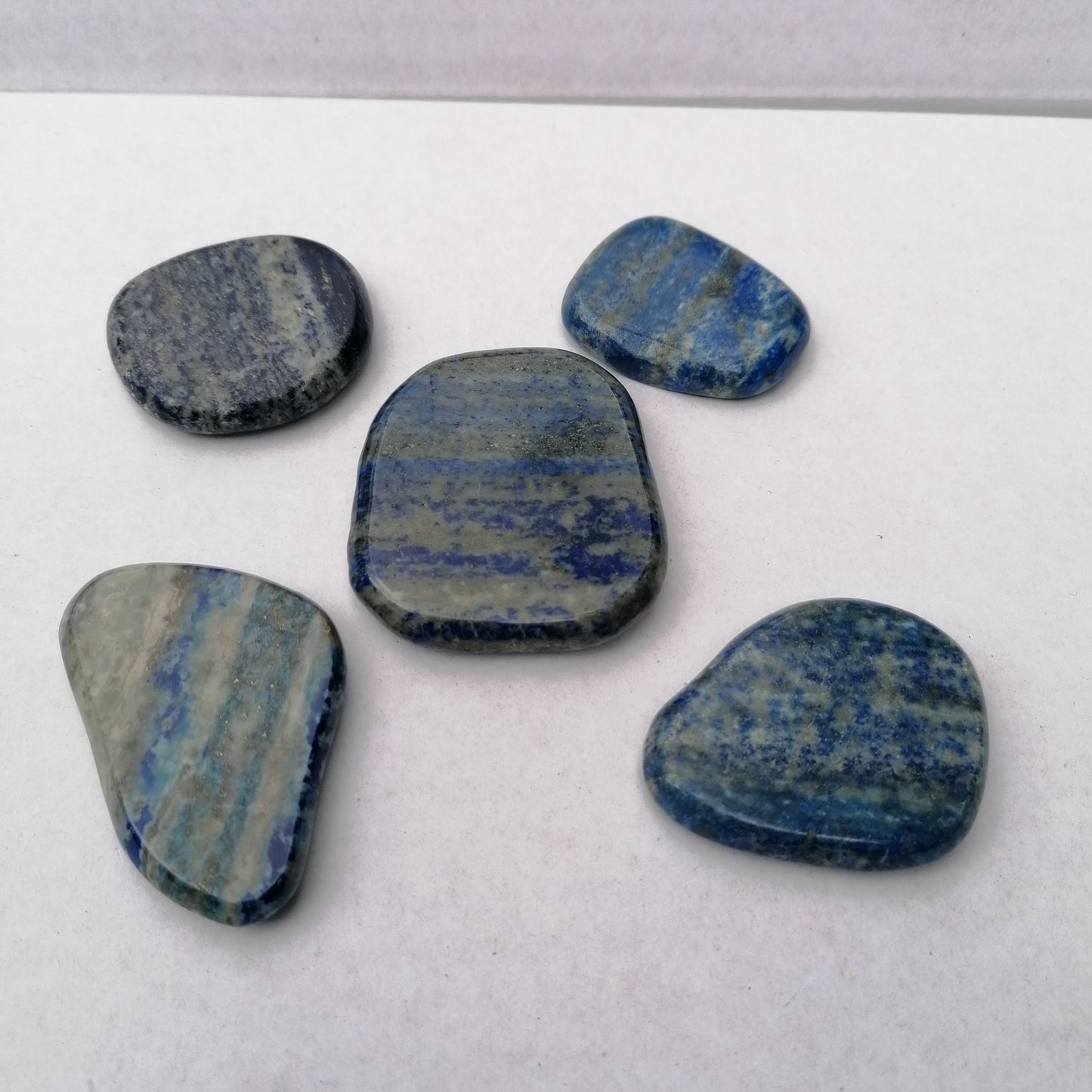 five blue gold and gray lapis lazuli smoothstones