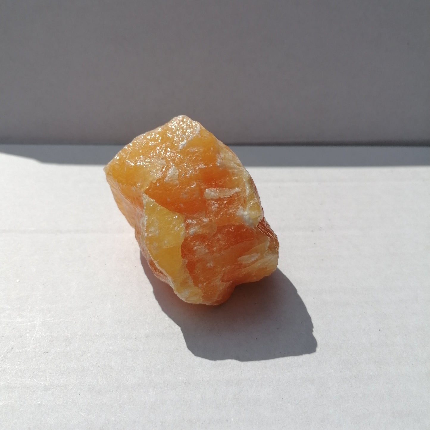 large piece of rough orange calcite in natural form