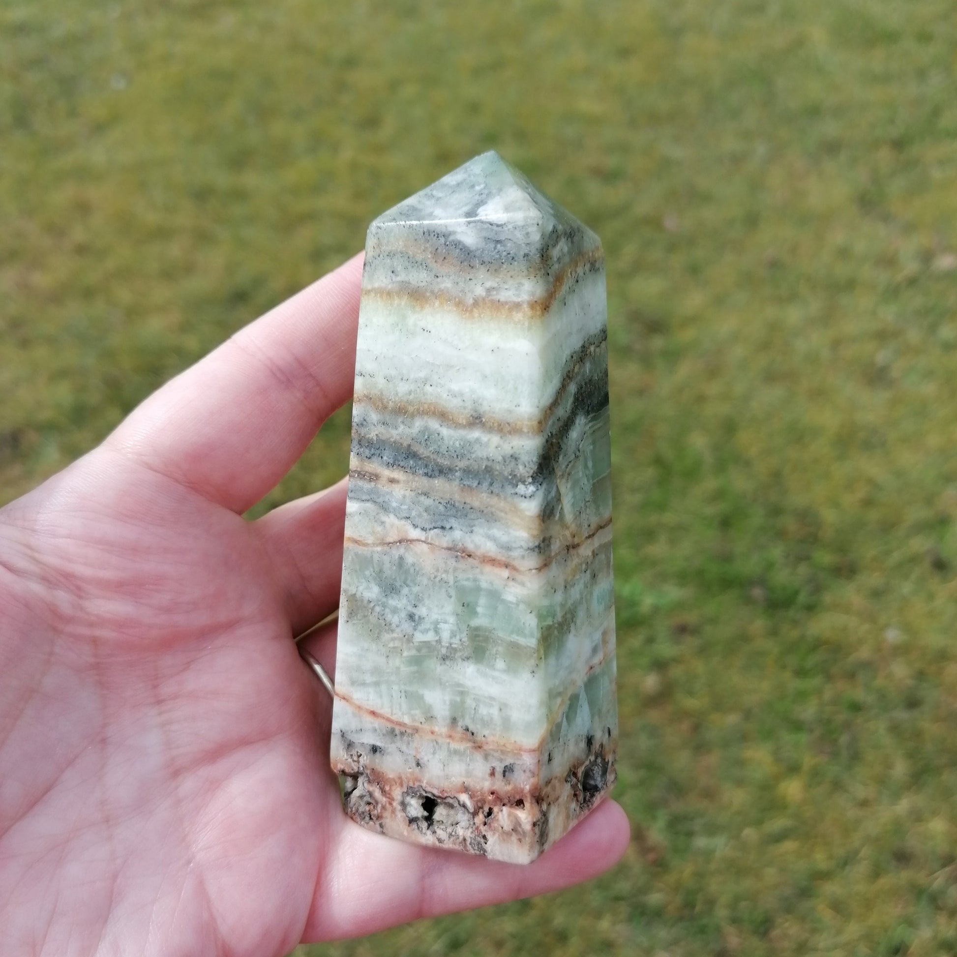 brown, green, black banded kiwi calcite tower point