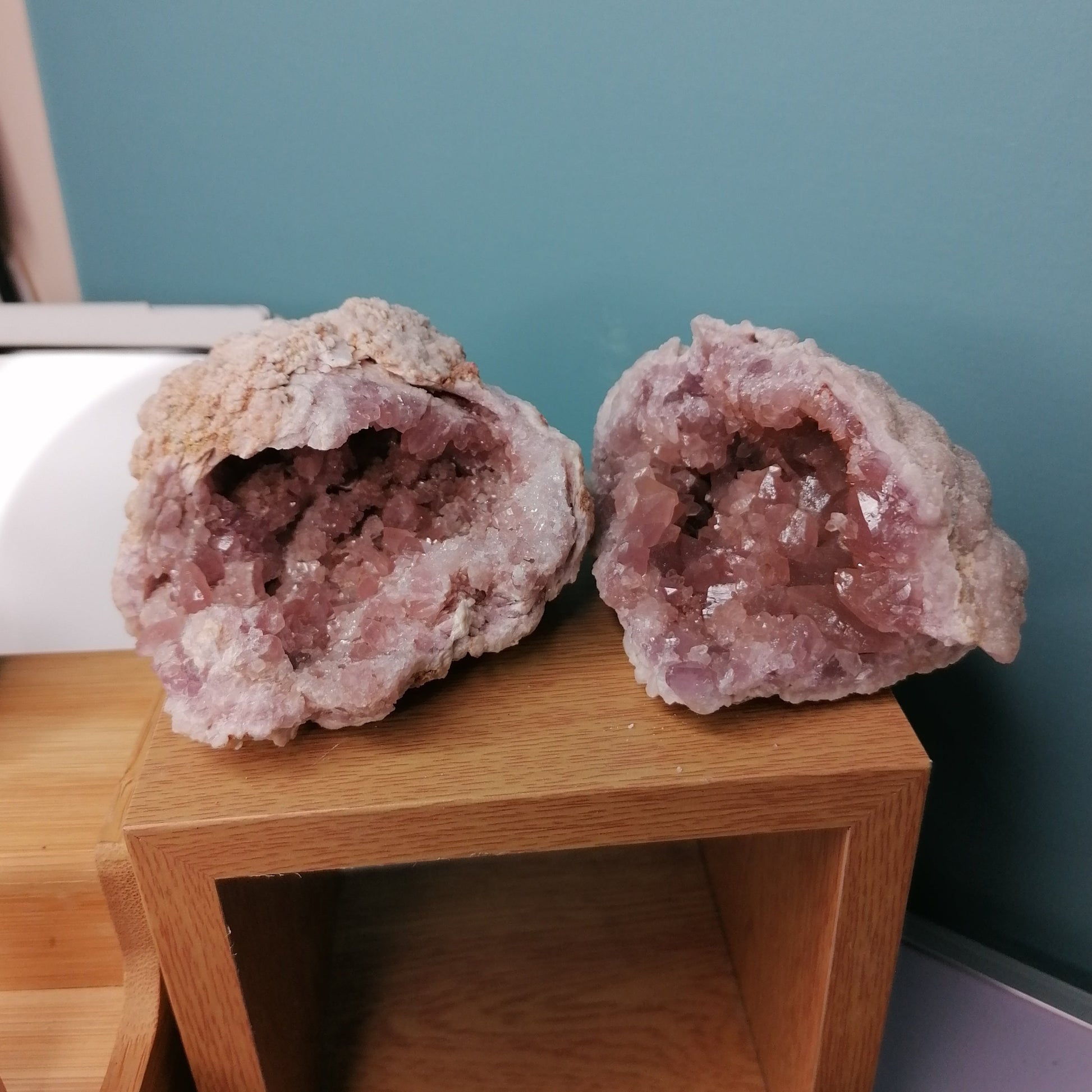 two large pink amethyst geodes