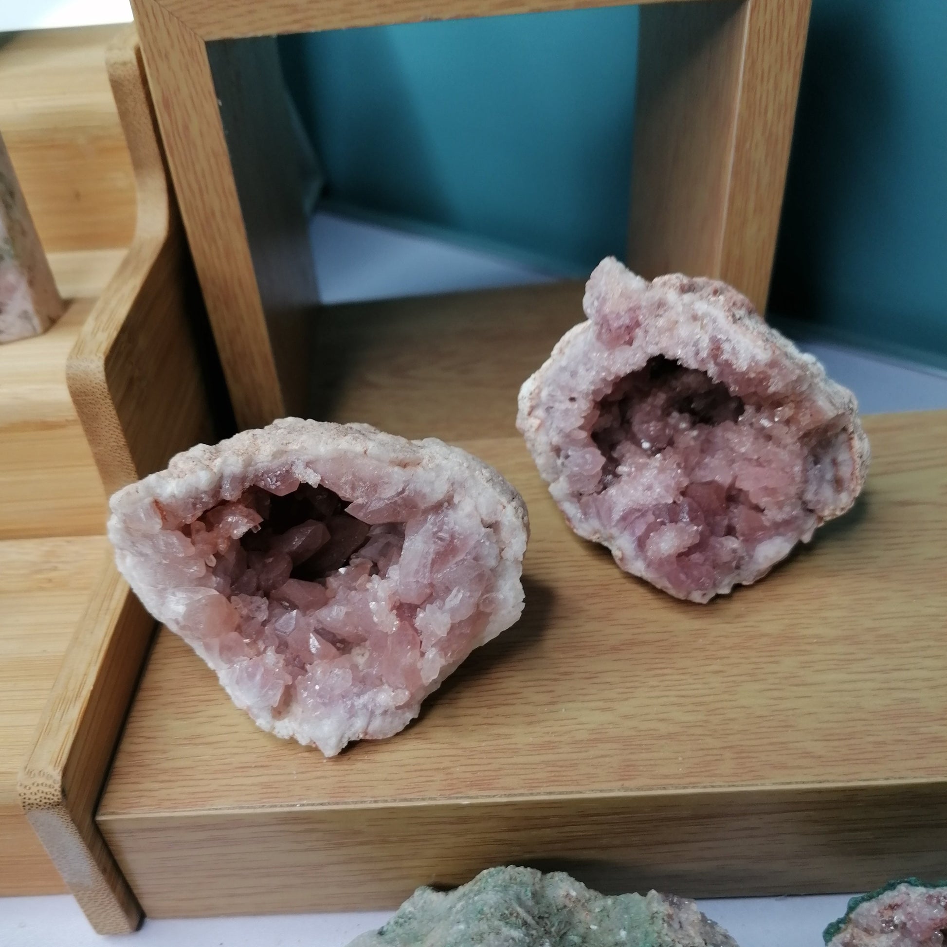 two large pink amethyst geodes