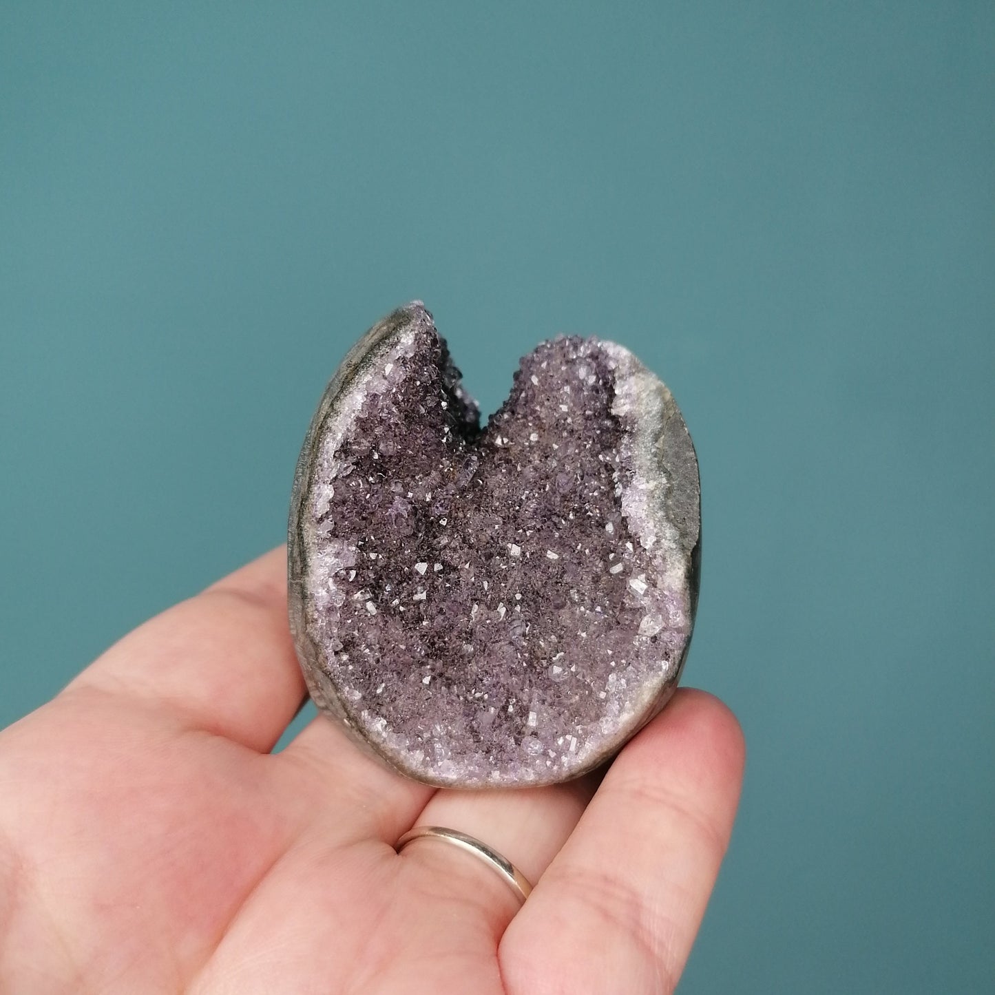 purple amethyst cut base with polished edge, round in shape with cut through the top