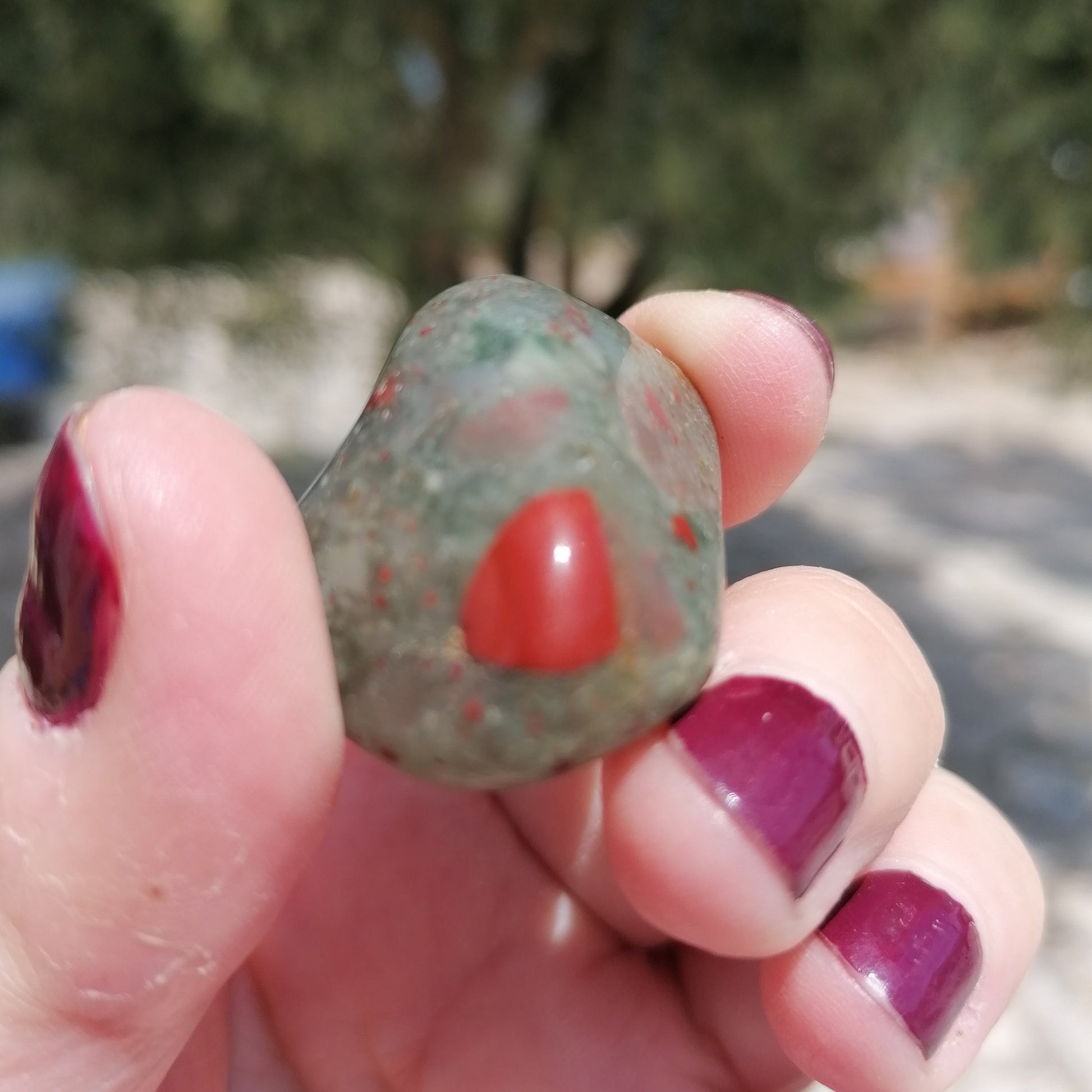 a green and red spotted bloodstone tumble