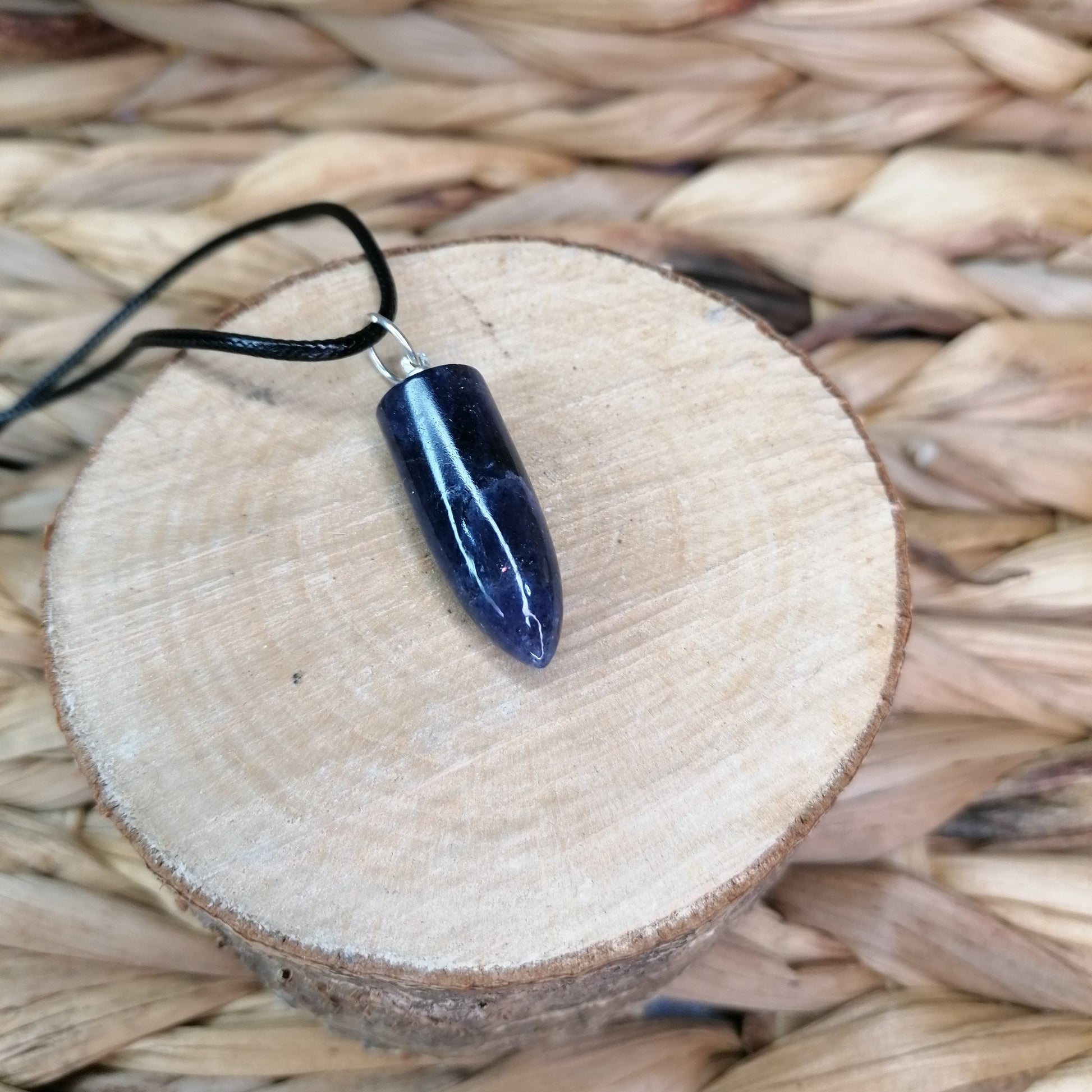 Purple Iolite Crystal Bullet Point Necklace on a black chord chain