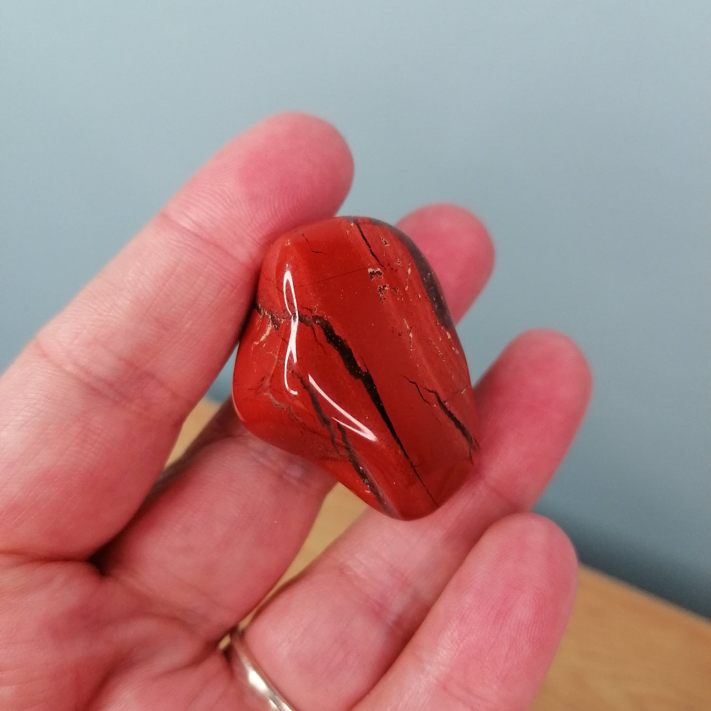 large red jasper tumble with black banding