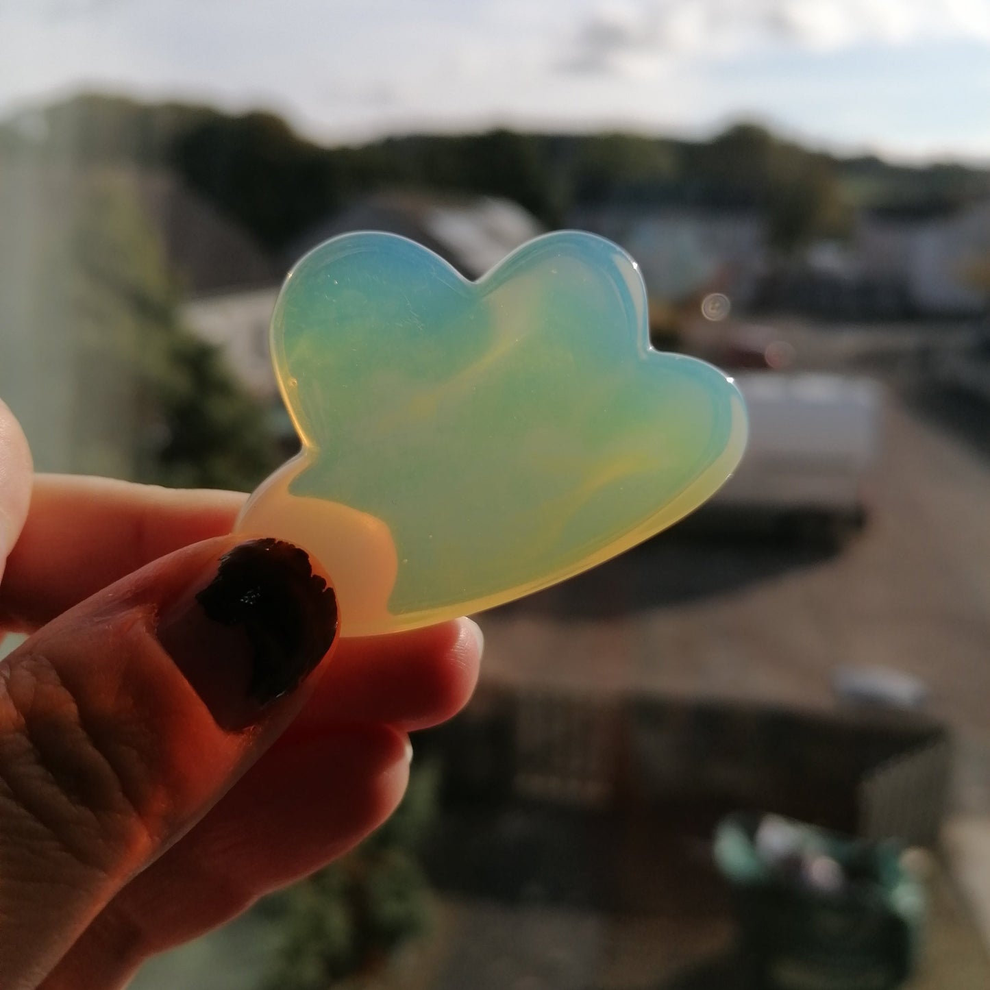White Opalite Crystal cloud that looks orange in the light