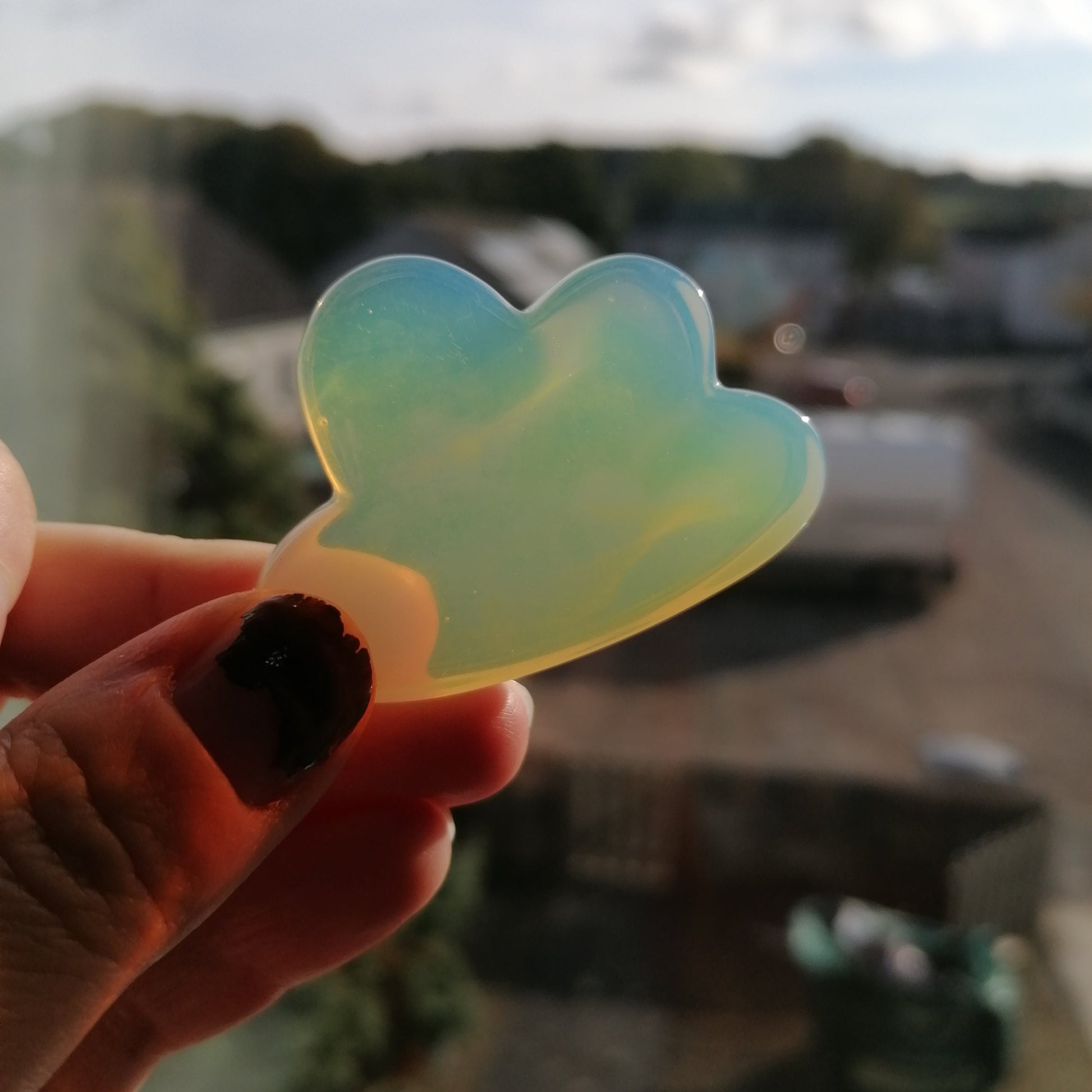 White Opalite Crystal cloud that looks orange in the light