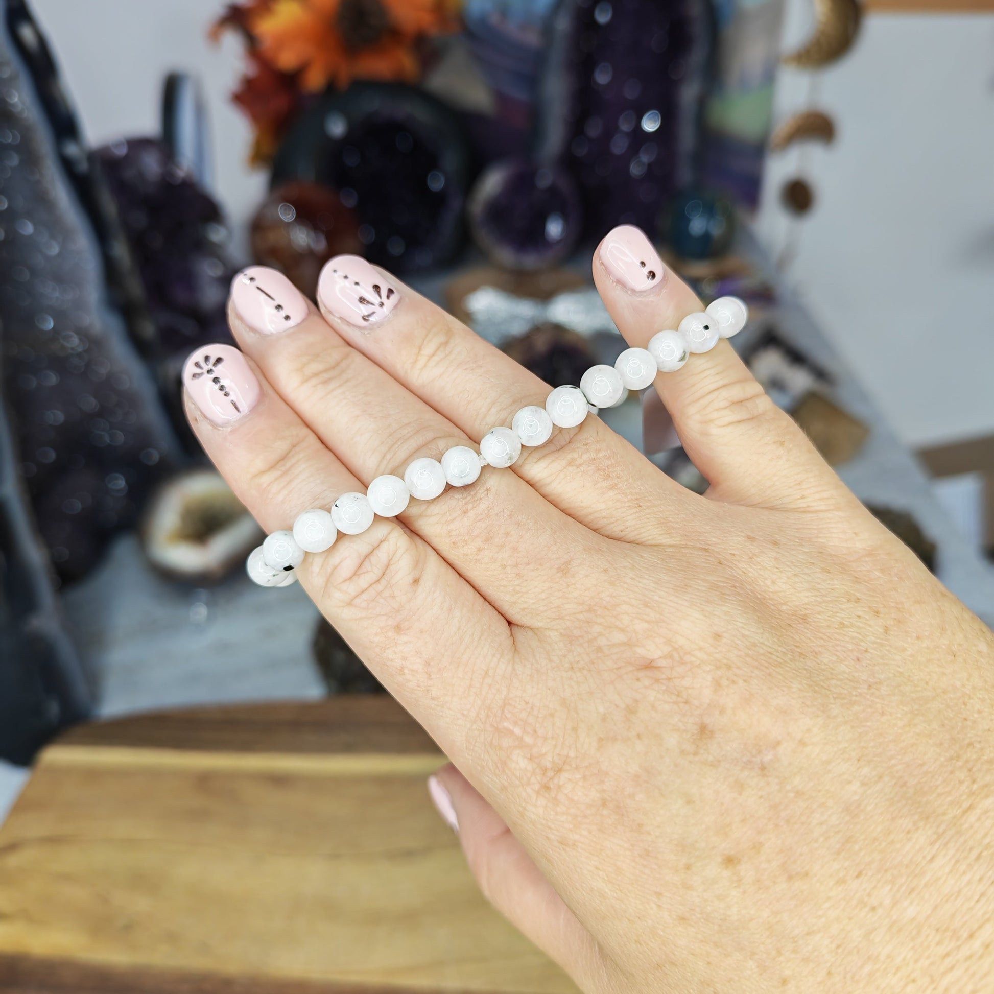 High Grade Rainbow Moonstone Bead Bracelet with White Beads, Black Tourmaline inclusions and blue flash 