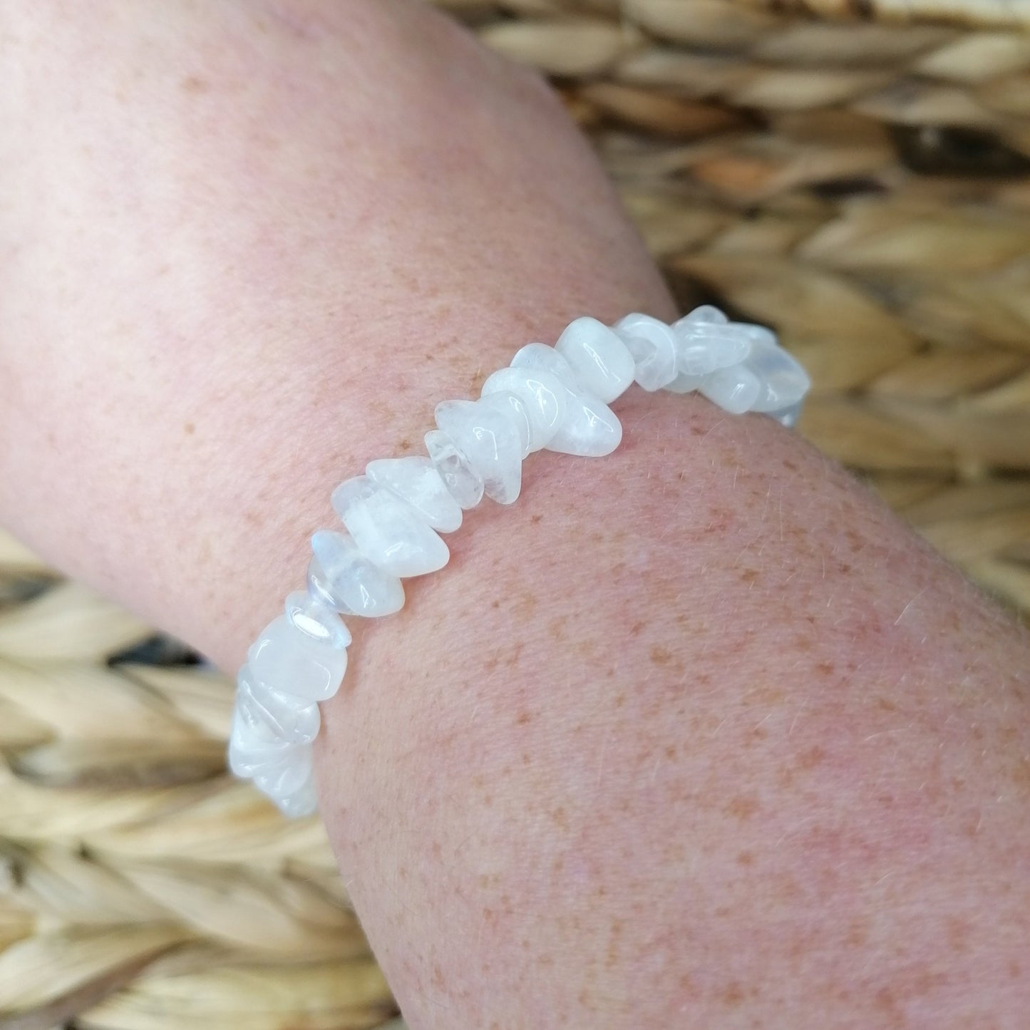 Rainbow moonstone bracelet with white crystal chips and a blue flash