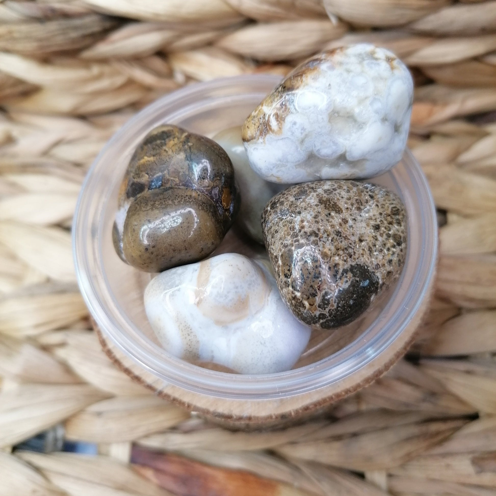 Brown and white spotted agate crystal tumbles