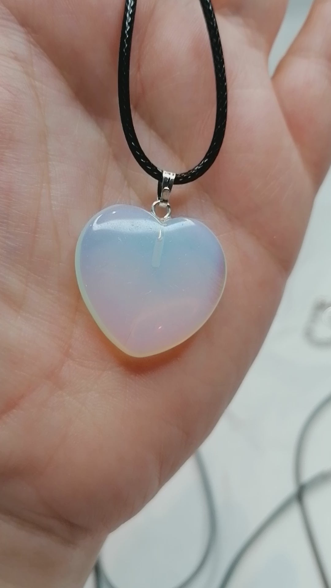 opalite heart crystal shining in the light