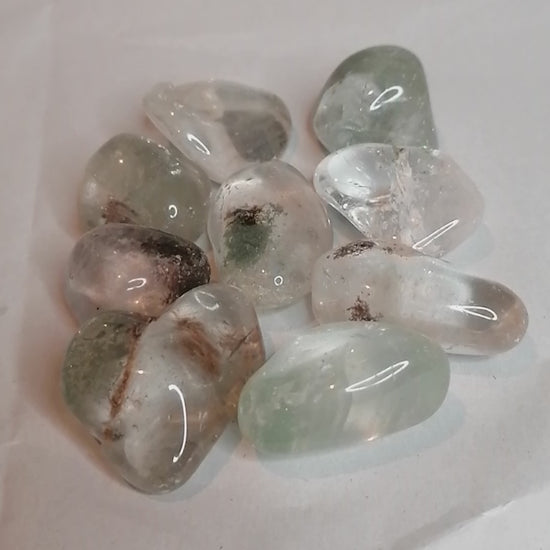 short video of the green and brown garden quartz tumbles from all sides