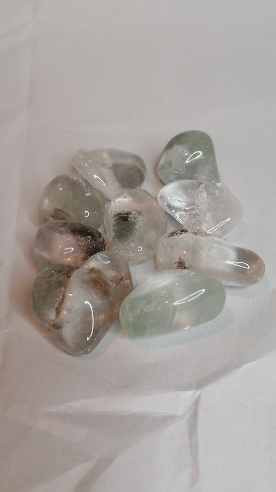 short video of the green and brown garden quartz tumbles from all sides