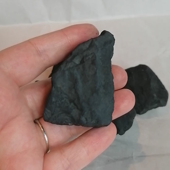 short video turning a piece of black shungite to view all sides