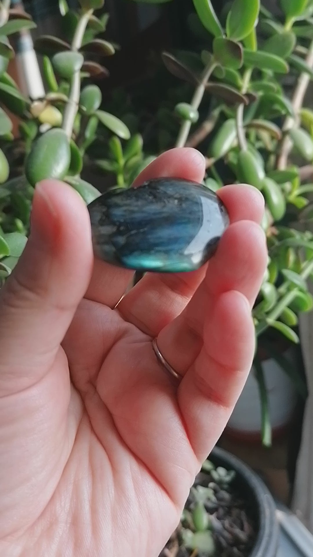 labradorite crystal heart with light blue and green flash