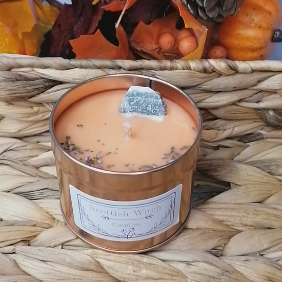 salted caramel crystal candle decorated with a zebra calcite crystal and scottish heather