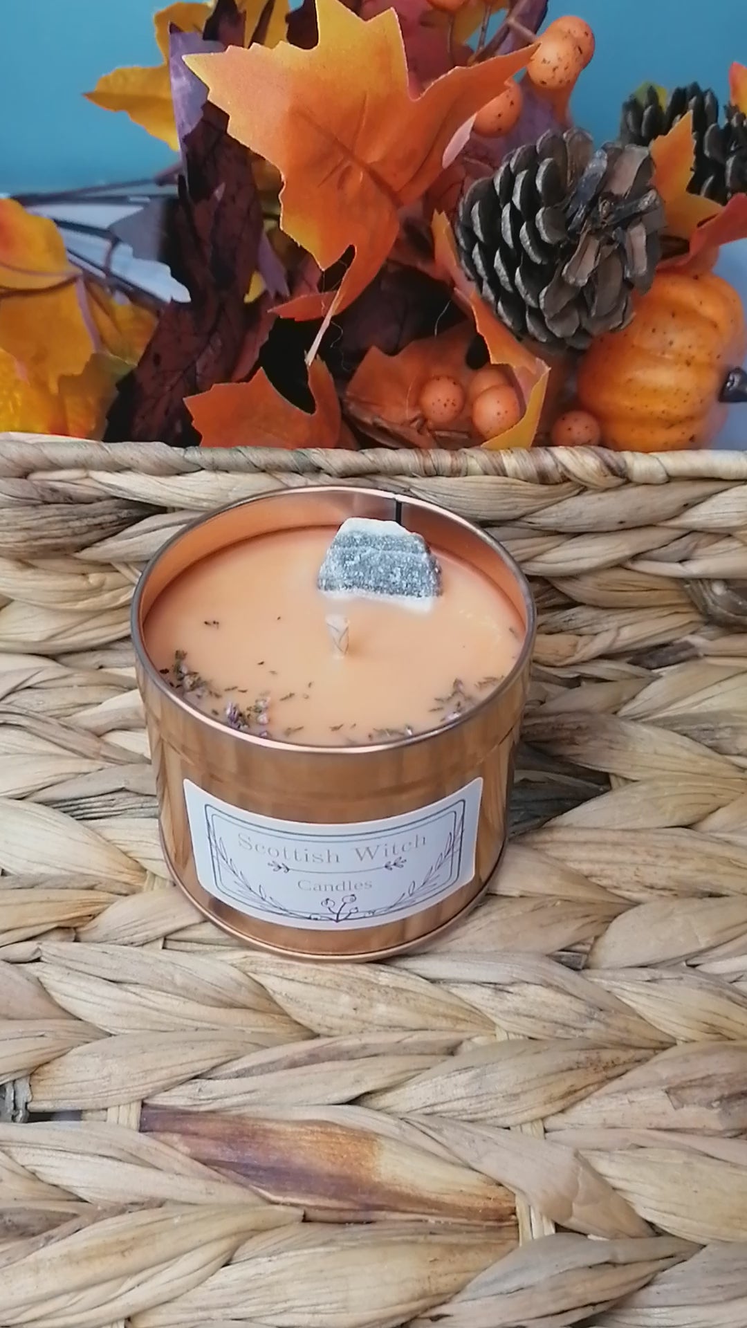 salted caramel crystal candle decorated with a zebra calcite crystal and scottish heather