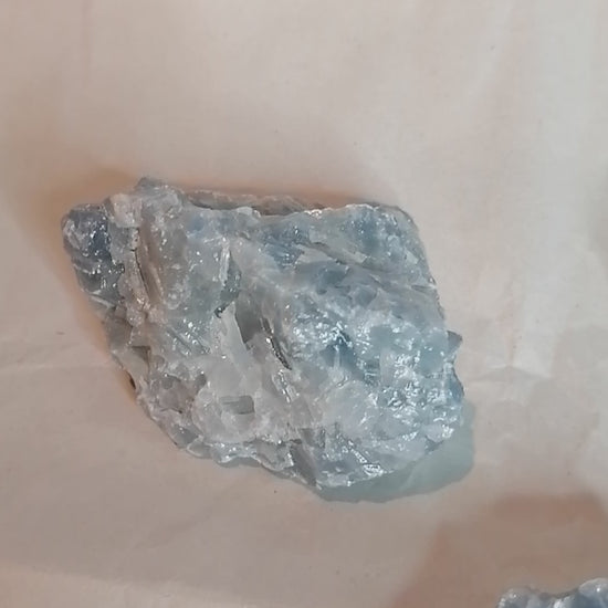 video of three pieces of blue calcite from all angles