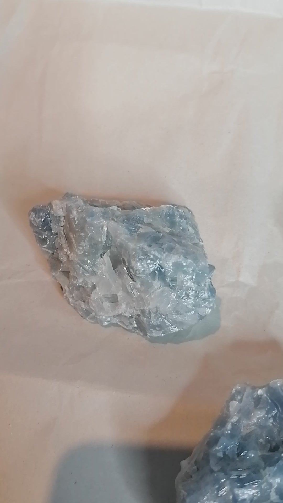 video of three pieces of blue calcite from all angles