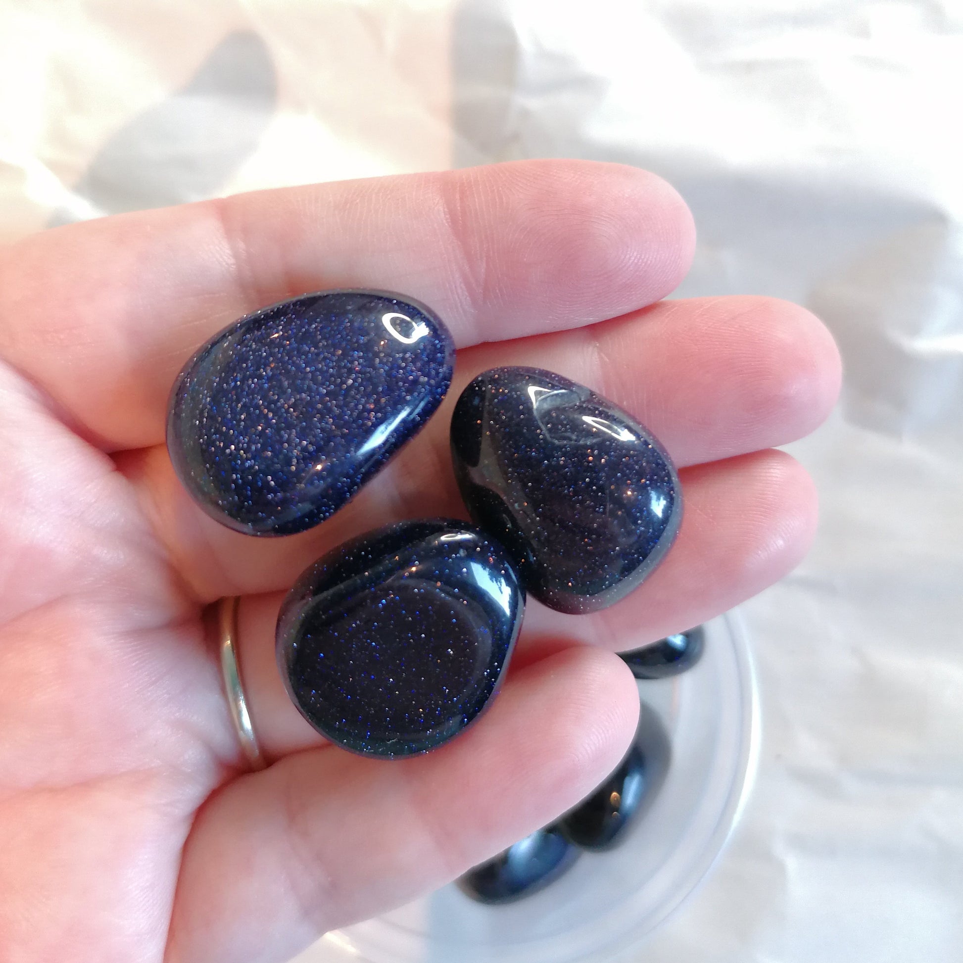 a blue sparkly goldstone crystal tumble