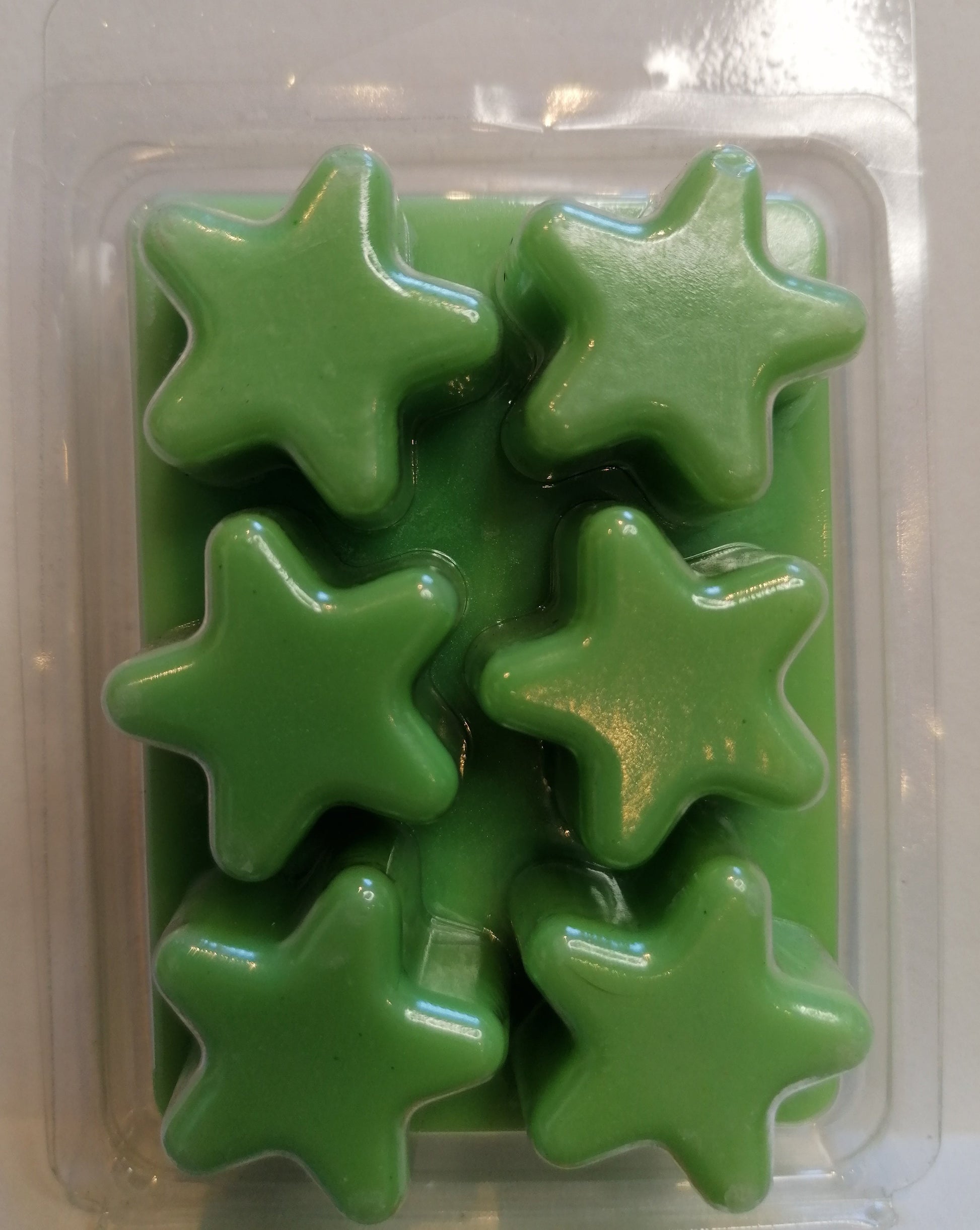 green wax melt in star clamshell